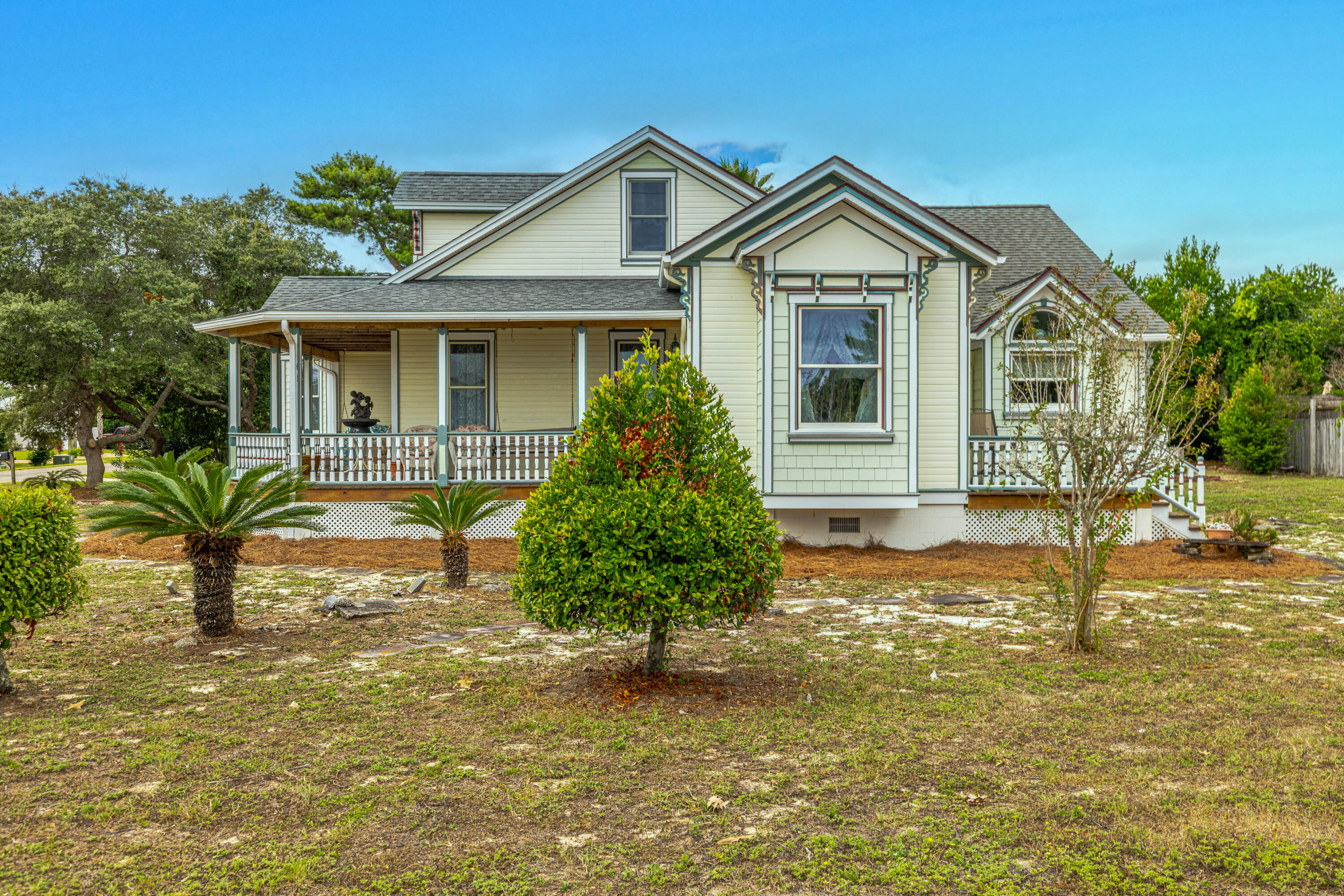 Charming Victorian at the Beach - 
Step into this unique Victorian-style home situated on a very large corner lot just blocks from the beach. With its classic wrap-around porch and timeless details, this home is filled with warmth, character, and plenty of space for making memories.
Inside, you will find 10-foot ceilings, solid wood doors, and bright, open rooms that feel both comfortable and inviting. The kitchen features custom cabinets and shelving, beautiful granite countertops, a Jenn Air downdraft range, and an extra gas cook top—perfect for preparing meals to share with family and friends.
Upstairs, a 260sqft bonus room with half bath offers flexible space for guests, hobbies, or a cozy retreat. Everyday living is kept easy with thoughtful features like a geothermal HVAC Charming Victorian at the Beach
Step into this unique Victorian-style home situated on a very large corner lot just blocks from the beach. With its classic wrap-around porch and timeless details, this home is filled with warmth, character, and plenty of space for making memories.
Inside, you will find 10-foot ceilings, solid wood doors, and bright, open rooms that feel both comfortable and inviting. The kitchen features custom cabinets and shelving, beautiful granite countertops, a Jenn Air downdraft range, and an extra gas cooktopperfect for preparing meals to share with family and friends.
Upstairs, a 260sqft bonus room with half bath offers flexible space for guests, hobbies, or a cozy retreat. Everyday living is kept easy with thoughtful features like a geo-thermal heating and cooling system, an 1100sqft, 3-car garage with workshop, and a laundry area with shower - a welcome convenience after beach days. The home's living space can also be expanded into the garage, offering you endless options for the future.
Step outside to enjoy a 316 sq. ft. wrap-around porch and a 144 sq. ft. deck, perfect for morning coffee, breezes, and sunset gatherings.
This is also a prime investment / short-term rental location. Blocks from the beach and just 10 minutes from Pier Park with its endless shopping, dining, and entertainment, and only 5 minutes to scenic 30A and South Walton's upscale dining, boutique shopping, and nightlife, you'll be at the center of everything the coast has to offer.