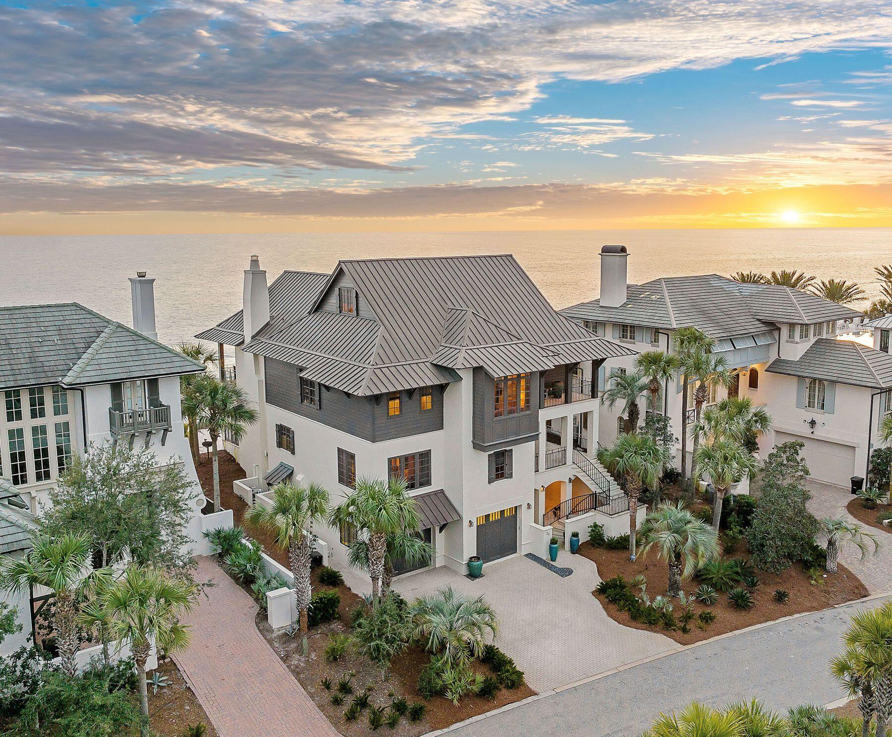 Sitting atop Blue Mountain Beach overlooking white sand coastal dunes, this beachfront home reflects the prestige of 30A's most desirable community, The Retreat. Deeded to water's edge, meticulous construction, ''smart home'' features, and year-round outdoor living make this an exceptional opportunity. South facing, this one-of-a-kind home offers uninterrupted 180-degree views to Destin and Panama City Beach. A whimsical entry door opens onto a sunlight-filled main floor highlighted by a grand staircase. This exquisitely fully-furnished masterpiece accentuates a light, bright interior while hardwood flooring and wood beams bring warmth throughout the living and bedroom spaces. Indoor and outdoor spaces are seamlessly joined by stone flooring. Four floors, five bedrooms and six-and-a-half baths are all easily accessed by elevator. The Dawn Thurber design flows effortlessly from one space to the next, providing a sense of peaceful sanctuary. A Control4 whole-house system manages heating and cooling, lighting and in-ceiling stereo filling rooms with convenience and music. A new copper roof was installed in 2020 and a complete exterior repainting completed mid-2023. The house is protected by an ultra-rare beach armoring system hidden under the dunes. Sitting 30+ feet above sea level and protected by its seawall, this home offers generations of serenity. A geo-thermal heating and air system adds to the value of this beautiful Gulf-front masterpiece. The recently renovated outdoor living space has a full summer kitchen and state-of-the-art mechanical pergola offering outdoor fun, rain or shine. A newly constructed home theater with Bang & Olufsen surround sound ensures endless entertainment. Multiple gulf-front bedrooms, including the primary, provide unparalleled living experiences, waking up to majestic sunrises and the sounds of lapping waves. Private balcony spaces and expansive outdoor relaxation areas encourage you to simply connect with the Gulf of Mexico. Offered turnkey including a Moke LSV, kayaks, paddle boards, and fishing gear this 5,500+-square-foot property delivers a lock-and-go experience rarely found in a beachfront offering. The Retreat features 3,000 feet of private gulf frontage, a world-class beach club, gated and guarded entry, direct access to Draper Lake for watersports, and a natural buffer courtesy of the State Park. Known as the most private community on 30A, residents enjoy exclusive beach chair and umbrella service, patrolled security and multiple community entertaining spaces, enhancing an idyllic ownership experience beyond compare.