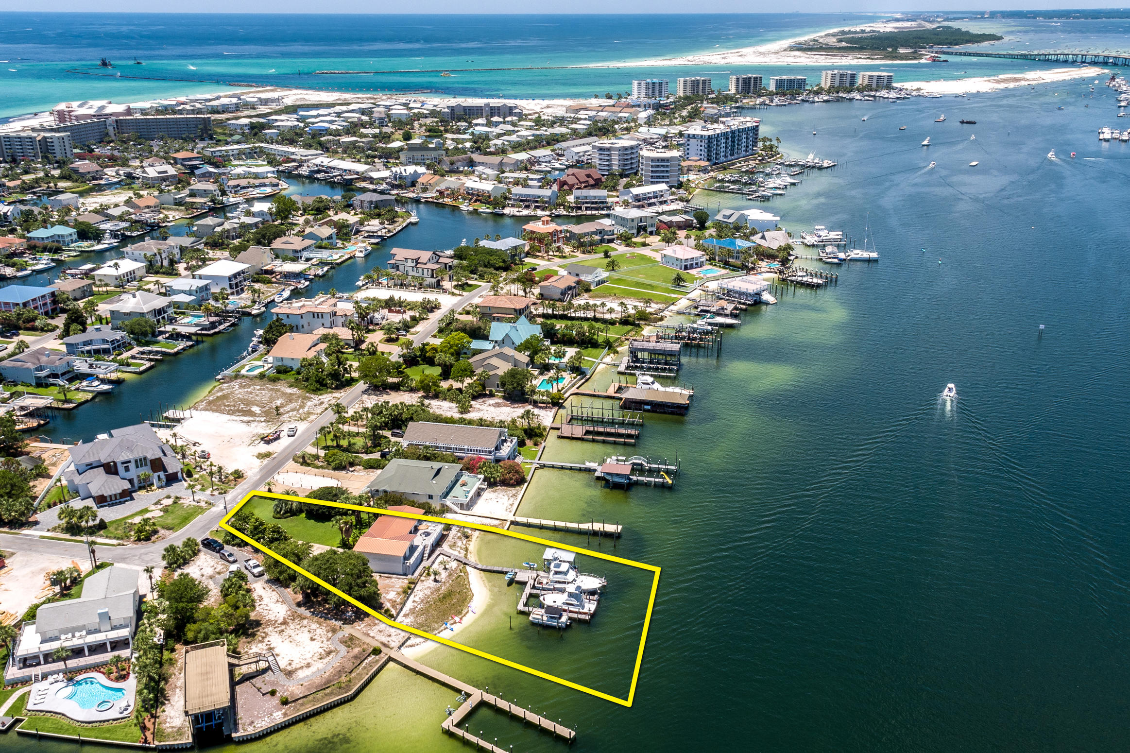 Approximately 133' on the Destin, Florida harbor! This superb, deep-water lot offers a perfect redevelopment site on which to build your custom, generational dream home. This rare offering represents one of the most coveted waterfront lots in the entire resort community of Holiday Isle, which offers residents access to multiple beach walkovers, one of which accommodates golf cart parking. Holiday Isle also is convenient to the areas most desired shopping and restaurants; some accessible even by boat taxi! Please inquire for further information, and to coordinate a private showing.