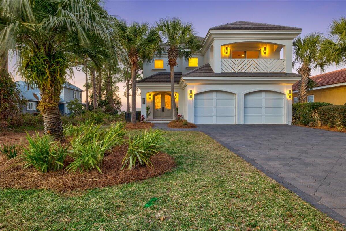 Fully furnished and completely renovated from top to bottom and the home has not been lived in sense the renovation. *OPEN WATERFRONT *SALTWATERPOOL *SOLAR PANELS *TWO MASTER SUITES W/ONE ON THE FIRST FLOOR *NO HOA. Welcome to your waterfront retreat located in Miramar Beach! This home has been completely renovated from top to bottom and nothing has gone missed, just bring your suitcase and you are home! When you enter the house, you will be greeted with French doors leading to an open floor plan and a beautiful view of the bay in the distance. As you continue through the home you will find the dining area and the kitchen. The kitchen features wood cabinets with quartz countertops, stainless steel...... appliances with a 6-burner gas range, two wine coolers, floating shelves, a walk-in pantry and an oversized waterfall island with quartz countertops. The kitchen comes fully equipped with everything you need from glasses and silverware to pots and pans. Next you will find the cozy living room that showcases chevron shiplap above the gas burning fireplace and an incredible view of the water. Off of the living room you will find one of two master suites. The first-floor master bedroom features a glass sliding door to the pool and overlooks the bay. The master bathroom features a walk-in closet, toilet room, a double vanity with quartz countertops, a soaking tub with and a white chevron tile accent wall that flows seamlessly into the shower (shower glass has been ordered). On the first floor you will also find a fully updated spare bathroom near the entrance with a floor to ceiling aqua tile backsplash, a new vanity with quartz countertops and beautiful gold accents. The laundry room is located off of the kitchen and comes equipped with a washer and dryer, cabinetry with a countertop for folding clothes and a sink. When you head upstairs you will notice the beautifully designed stair railing that is the perfect contrast to the snowbound walls. There is also a beautiful woven basket chandelier that hangs from the second floor. (The second-floor features two ensuites and two additional good-sized bedrooms with a jack and Jill bathroom). As you reach the top of the stairs you will find the first ensuite that showcases a balcony off of the front of the home with beautiful chevron railing and a large walk-in closet. The bathroom features wood cabinets, quartz countertops, a linen closet and a soaking tub with an aqua tile accent wall.

As you continue down the hall you will find the third bedroom with a walk-in closet and a jack and jill bathroom leading to the fourth bedroom. The bathroom features a shower with black and white floor to ceiling tile and wood vanity with quartz countertops. The fourth bedroom features a private balcony overlooking the bay. Next you will find the second-floor master suite that also features a private balcony with an incredible view of the bay! The master bath features two closets, two vanities with quartz countertops, a toilet room and a beautiful floor to ceiling tile walk in shower. As you head downstairs and step out of the back door you will be blown away with the view and outdoor features this home has to offer. Under the screened lanai you will find the heated saltwater swimming pool with an elevated spa that flows into the pool and is surrounded by pavers. The pool has been recently refinished and showcases aqua accent tiles along the water's edge. You will also find an outdoor shower, outdoor kitchen with a gas grill, ice machine and a sink. As you continue your way to the water's edge you will notice the newly sodded backyard with a fence and sprinkler system (front and back). You will also find your own private beach and a dock leading to the boat lift, sunbathing platform and the fish house. The covered boat slip features an 8,000-pound boat lift that sits on the west side of the dock and there is space for a second lift on the east side. When you reach the end of the dock you will find the screened in fish house with an ice machine, refrigerator, a seating area and a fish cleaning station outside of the door (power and water on the dock). As you walk upstairs to the sundeck you will be impressed with the incredible view. The entire home has been painted with elastomeric paint, has a cement tile roof and the driveway features pavers. There is also a large storage room on the third floor with open cell spray foam insulation.

A few additional features and upgrades: new lighting, new door hardware, new cabinet hardware, new mirrors, new toilets, new luxury vinyl plank flooring, two newer AC units, 7ft baseboard, crown molding throughout, ring security system, nest thermostat All sizes, ages are approximate, please measure and/or verify if important