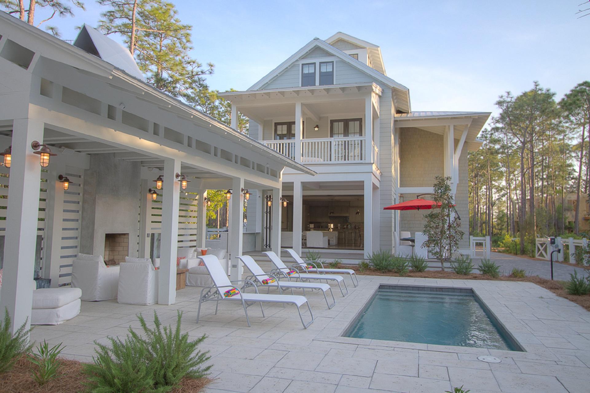 Located on the most coveted street in WC on one of the largest lots in WC, this 6 bd 6.5 ba. house has it all!
Open concept floor plan with a wall of lift and slide windows opening to a huge entertainment area featuring a pool, pool cabana complete with fire place and wall fountains, outdoor shower, outdoor kitchen and plenty of room for large group gatherings. This home features a two car garage with a carriage house above, in addition to 5 other ensuite bedrooms and a tower. This large lot is fully fenced and gated with tons of parking, this home is has everything needed to be an amazing full time home. Very few if any homes in WC have the parking capacity this home has making its income potential tremendous! This home is sold fully furnished with a couple art exceptions.
