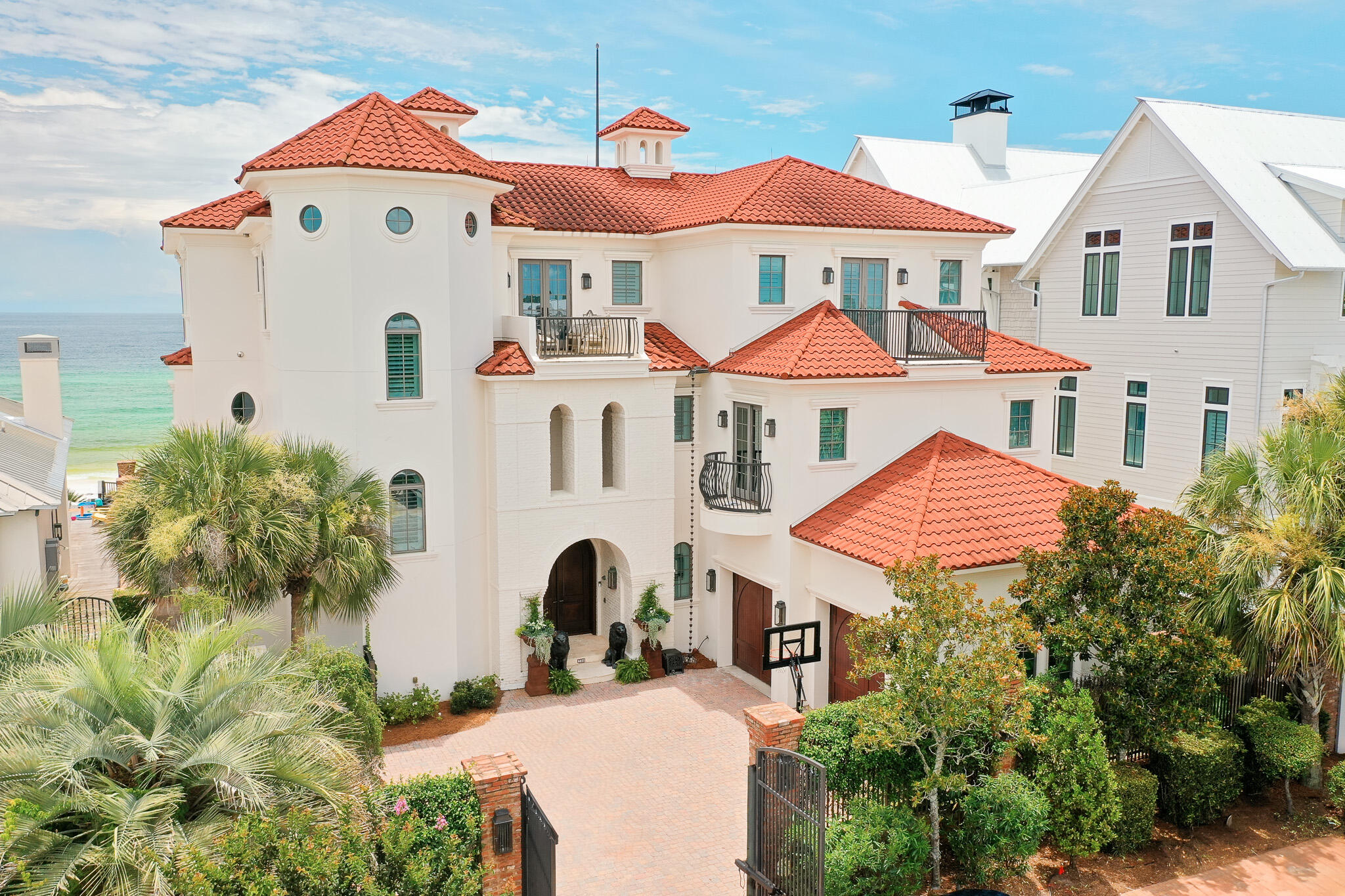 Commanding 75' of Gulf frontage from the highest bluff along Florida's Emerald Coast, 756 Blue Mountain Road is more than a home; it is a fortress of refined coastal living. Completed by the renowned Davis Dunn Construction, its structure is a masterclass in elevated engineering: brick masonry and stucco over insulated concrete, designed to withstand time, tide, and the elements without sacrificing elegance. This is not simply a residence built by the beach; it is one of the rare Gulf-front estates where beauty and permanence are given equal weight, and where every detail, from foundation to finish, speaks to an uncompromising standard. Spanning over 8,200 square feet behind a gated brick courtyard, the home has been newly refined to reflect the ease and sophistication of modern coastal life.

From the moment of entry, the tone is set: whitewashed hardwood floors, curated lighting, and fresh finishes offer a softened palette that mirrors the ever-changing hues of the Gulf just beyond. The main leveldesigned for daily life and effortless entertainingflows through open living and dining spaces to a south-facing pool terrace, where newly retiled surfaces and fire bowls frame the sea beyond.

The chef's kitchen, scaled for hosting and grounded by its clean lines, connects seamlessly to the living spaces, while walls of glass welcome in the horizon. Step outside, and the tempo slowsprivate pool, spa, and a boardwalk leading directly to the sand and surf.

With seven ensuite bedrooms thoughtfully arranged throughout, the layout supports both connection and privacy. The owner's level occupies the top floor entirelyfeaturing a spa-like bath, dual closets, private sun deck, office, and sitting room, all oriented to maximize light and Gulf views. An observatory crowns the home with wraparound views that stretch far beyond the shoreline.

The second floor is home to a grand leisure retreat,a space designed for unhurried days and unforgettable nights. Styled with the same coastal sophistication that runs throughout the home, it's the ultimate game escape, perfect for billiards, cards, or simply gathering with friends after sunset. Rich textures, layered lighting, and Gulf breezes spilling through nearby balconies make it a destination in itself, blurring the line between relaxed play and refined living.

Behind its beauty, the home's systems quietly elevate daily life: a geothermal heating and cooling system for efficiency and comfort, a whole-house water filtration system, a private irrigation well, and a newly installed whole-house generator. Every element has been considered to ensure the home's performance matches its presence.

Every detail has been quietly consideredfrom the whitewashed floors to the newly refinished surfaces, soft coastal palette, and elevated lighting throughout. Offered fully furnished with curated exclusions, this is a home that speaks in a language of restraint, elegance, and enduring quality.

Positioned in the heart of Blue Mountain Beach along 30A, with proximity to Seaside, WaterColor, and world-class dining and shopping, 756 Blue Mountain is not just a residenceit's a legacy anchored in sand and sea.