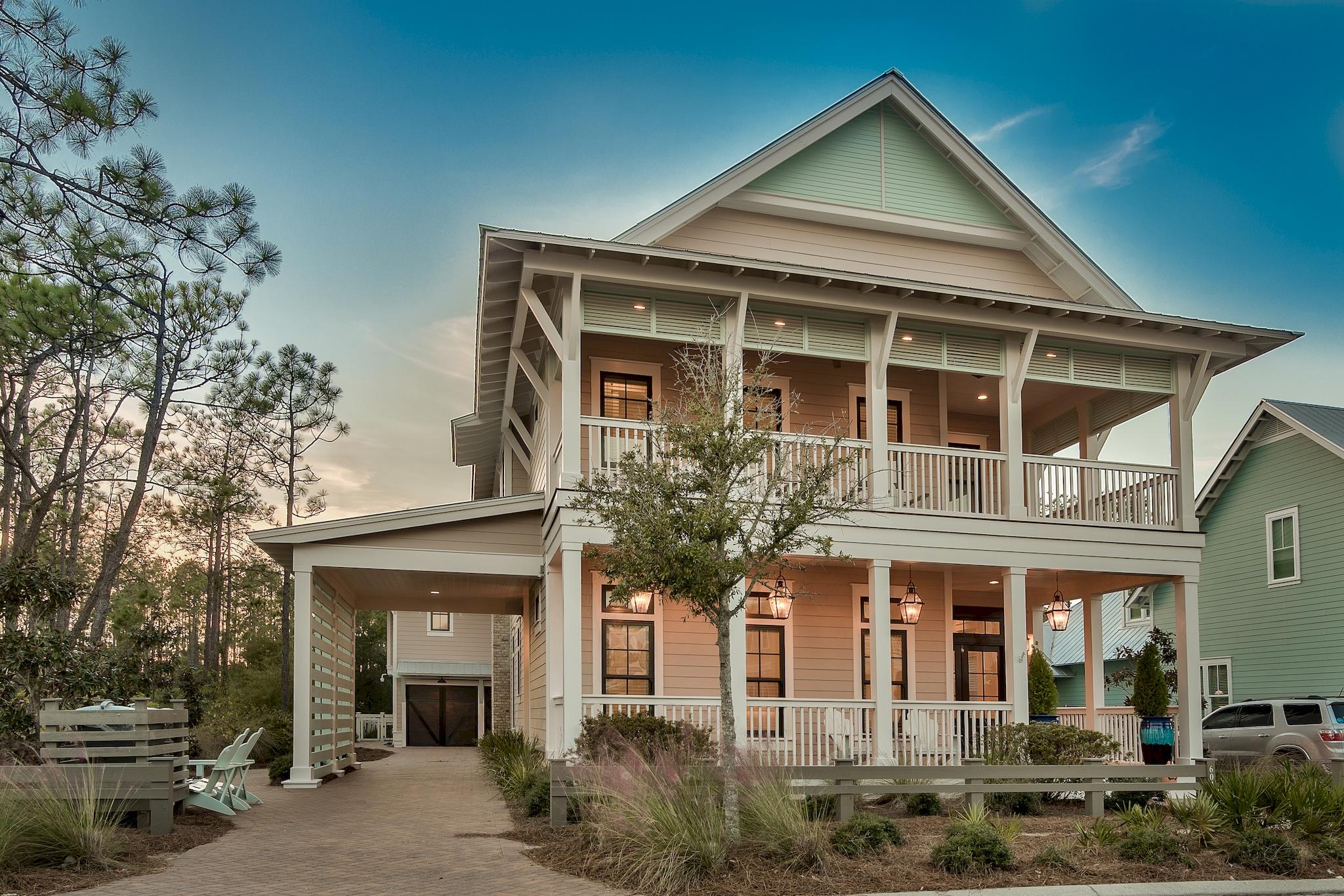 This custom-built WaterColor home offers 4,082 square foot of coastal living with 6 bedrooms and 6.5 bathrooms. *Check out the lifestyle video and virtual tour of this amazing property in the Photos section.* The main house features 4 bedrooms and a drive through porte-cochre leads to the carriage house that features 2 bedrooms. The oversized porch features beautiful Cumaru wood decking, tongue and groove wood ceilings, copper light fixtures and magnificent double mahogany doors. Stunning custom interior details include wide plank Ash wood floors, shiplap walls, custom molding and cabinetry throughout. The first floor offers a free-flowing layout with a combination of transom-topped windows and French doors that bathe the living and dining area with an abundance of natural light. The main living area is anchored by custom built-in bookcases that showcase the gas masonry fireplace. Entertain in grand style with a dining area that comfortably seats 12 or more guests and is accompanied by a wet bar. Adding to this spacious area is the incredible gourmet kitchen, featuring Carrera Marble countertops, custom cabinets and an oversized island with breakfast bar. Luxurious appliances include Wolf Duel Fuel 48" double oven, gas range and hood, Sub Zero Towers for the refrigerator and freezer, Sharp microwave drawer and a Wolf Espresso maker.

The first floor also includes a spacious bedroom with an en-suite bath and walk-in closet, a half bath, and laundry room, for your convenience.

A custom oak stairway leads to the second floor, where there is an inviting space with custom barn doors leading into the media bonus room. The master suite, two guest bedrooms and an in-home office are also located on this floor.

The spacious master suite features three sets of French doors that open to the private balcony overlooking the pool area. Sliding barn doors open to the master en-suite where there is plenty of space with double walk-in closets, built-in shelving and a sitting area in the closet. The bathroom boasts an elegant soaking tub, dual marble vanities and full tile and glass shower.
Both additional bedrooms feature en-suite baths, offering overnight guests their own private space.

Just off the back porch is a separate carriage house mother-in-law suite above the 2-car garage. The 2 bedroom and 2 bathroom suite, is accented with elegant details including shiplap walls, recessed lighting and tongue and groove ceilings. With a living room, kitchenette, and laundry room, this suite offers additional accommodations as well as privacy from the main house.
The kitchenette is well designed to be self-sufficient, with a marble top island, breakfast bar, sink and refrigerator. Inside the large 2-car garage there is plenty of space for a golf cart.

Between the main home and carriage house is a beautiful Cumaru wood deck and pool area. A gunite pool and plenty of decking can handle all your entertainment needs. The outdoor shower is great to rinse off after a trip to the beach or a bike ride. This elegant WaterColor home is surrounded by Point Washington State Park and just a short walk or bike ride to the beach. Centrally located amongst vast amounts of nature and all the local spots, you can truly start living the ultimate beach lifestyle today.