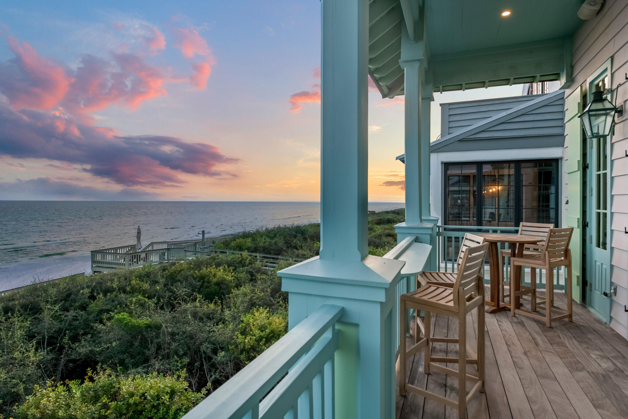 Nestled within the charming enclave of Rosemary Beach, where white sandy shores meet azure Gulf waters, you'll discover the epitome of coastal luxury living inside this Gulf Front beach cottage. This exceptional 4-bedroom, 4-bathroom home offers a captivating blend of elegance, modernity, and breathtaking views that will leave you spellbound.

As soon as you step inside to the foyer, you will immediately notice the mix of contemporary concrete scored floors, arched hallway, and shiplap running down the hallway. The first floor is home to the first of four bedrooms with accompanying bathroom across the hallway. The true star of the first floor is the primary bedroom and en-suite that has been thoughtfully remodeled and expanded, offering a private haven of tranquility and is a true masterpiece. Meticulously expanded to provide an even more indulgent experience, it now boasts a spa-like bathroom with a soaking tub, dual vanities, and a walk-in shower.

The moment you step upstairs, your gaze is drawn to the expansive living room, where walls of windows frame the stunning Gulf panorama, creating a seamless fusion of indoor and outdoor spaces. High coffered ceilings with intricate detailing add a touch of grandeur throughout the open-concept living area, reflecting the warm, natural light that bathes the room. The kitchen is a culinary haven, featuring sleek, stainless steel Viking appliances to custom cabinetry and marble countertops, every detail has been carefully considered. Upstairs is a third floor, loft bedroom with its own sitting area and offers views looking out at the gulf.

As you step onto the expansive deck that overlooks the azure waters of the Gulf of Mexico, you're immediately greeted by the breathtaking scenery that defines this coastal paradise. The outdoor space, which extends the length of the home, offers the ideal setting for sipping your morning coffee while the sun rises, or indulging in an evening cocktail as the sun sets in hues of orange and pink over the horizon.

Adjacent to the main residence, a full carriage house offers additional accommodation options for guests or family members. This separate space allows for privacy and convenience, with a kitchenette and cozy living area. It's an ideal retreat for those seeking a bit more solitude, while still being just steps from the main house.

Rosemary Beach itself is a masterpiece of New Urbanism, and you'll have access to all its amenities such as private owner's pool and pavilion, fitness center, tennis courts, four community pools, and multiple greenspaces intermingled within the community. One of Rosemary Beach's defining features is its meticulously planned layout, designed to encourage walking and cycling. The pedestrian-friendly streets wind their way through a collection of elegant homes, boutique shops, and restaurants, all within easy walking distance.

Rosemary Beach is a coastal paradise that combines the timeless allure of a traditional beach town with the convenience and luxury of modern living. Its carefully planned layout, welcoming community spirit, and abundant amenities make it an ideal destination for those seeking an idyllic coastal lifestyle or a tranquil retreat by the sea.