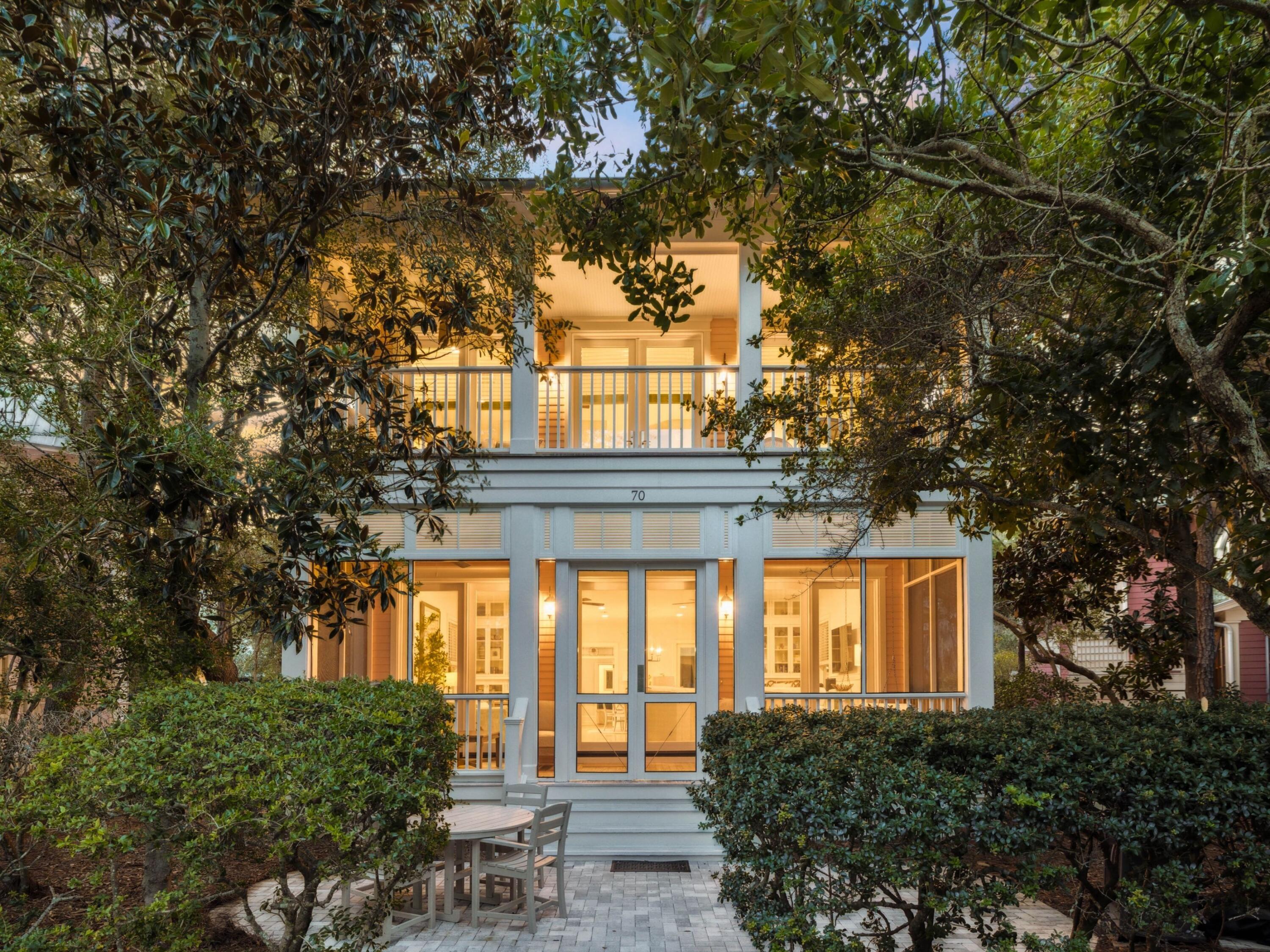 Tucked away in the coveted Park District of WaterColor Phase I, 70 Sunset Ridge Lane is light, bright, and open, having undergone a complete remodel in 2021 to pair the charm of classic coastal architecture with thoughtful modern updates.  Located in the intimate Rose Garden Mews, one of only twelve homes encircling the lush and peaceful Crimson Park, this residence offers a rare blend of privacy and accessibility.  Designed to bring the beauty of the outdoors inside, the home's serene setting is complemented by its proximity, less than 1,000 steps, to the WaterColor Beach Club, the WaterColor Hotel, and Marina Park, and within easy walking or biking distance to tennis courts, Camp WaterColor, and Seaside. On the main level, a spacious open-concept living, dining, and kitchen area creates the perfect space for entertaining and everyday enjoyment. A guest bedroom with a private en suite, a convenient powder room, and a generous screened-in front porch overlooking Crimson Park provides both comfort and functionality.

Upstairs, the primary suite boasts a private, covered balcony with park views, providing a serene setting to start or end your day. Two additional guest suites each feature en suite baths, while two upstairs sitting areas offer flexible spaces for lounging, working, or even adding a bunk room if desired.

The renovation included full bathroom updates, fresh interior paint, and a tankless water heater. All windows and doors were replaced with hurricane-impact-rated versions, enlarged to increase natural light, and hurricane shutters were added to every window. The property also benefits from access to four HOA-dedicated parking spaces, a rare and valuable amenity in this prime location.