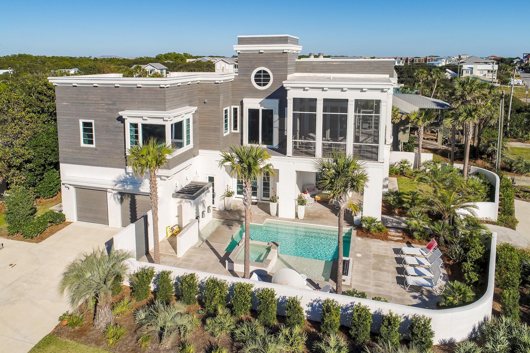 This state-of-the-art Blue Mountain Beach gulf-view residence is a sleek, contemporary home like no other. A charming blend of glass, marble and stainless steel, the home has a multitude of floor to ceiling windows that flood the spaces with natural daylight. The 4-BR, 6-BA property pairs the most brilliant cutting edge architecture with high tech accoutrements for a smart home without
compromise. A spectacular wood wall in the living room sports a gas flame feature set in marble with a large flat screen television slightly recessed above it and enchanting cubbies displaying fine art and favorite books. Abundant LED track lighting and cable railings lend a light industrial touch, and the open kitchen with wood ceiling, center island and marble countertops is very chic. Corner bay windows in one of the master suites bring the Gulf of Mexico's sparkling waters to your view, along with palm tree tops. The bedrooms embrace resort quality, and every bathroom is like stepping into
a fine spa venue. Outdoor entertaining is ravishing with a large second story screened patio overlooking the Gulf and your own beautiful swimming pool and hot tub. There is a gas stone firepit attraction, multiple water features and plenty of poolside space for lounging in style. Designed by Architect J. Terry Bates and built by BRW Construction.