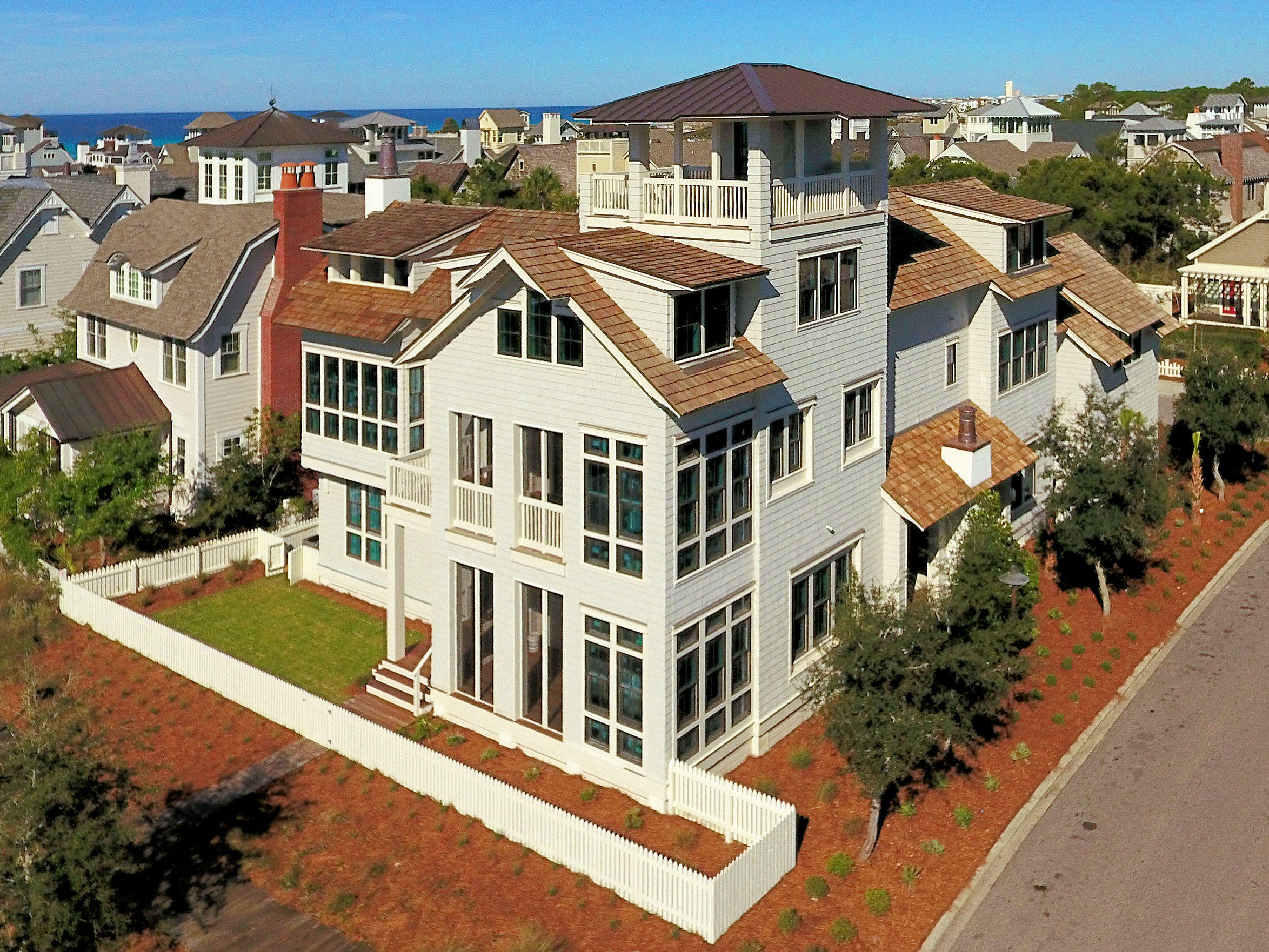 Placed on one of the largest lots in the premiere 256 acre gated community of Watersound this beautiful home provides the ultimate in a sophisticated coastal lifestyle.The architect has created the perfect combination of multiple retreats and gathering spots which provides the perfect intimate environment for two or twenty.
Indoor and outdoor spaces invite you to come relax and be at home.The home has a two car garage and a separate golf cart shed. You enter this amazing compound through an inviting water feature which draws you in to a spectacular outdoor living space with your private pool. The pool can be opened to an interior living space and porch with a fireplace. Private guest suites, gulf views from multiple locations...this home is amazing and unique. Put it on your must see list With a total square footage of 5820 the home is arranged to create comfortable and flexible living space.  The first floor invites you in with a large pool and deck along with a large grilling area, sink and refrigerator.  A trio of copper wall scuppers provides the  sound of gently splashing water. There is an easy access powder room for use from the pool deck, and a wall of bifolding doors to open the outside area into the interior pool den. Off the opposite side of the pool den is a screened fireplace porch providing an additional seating area. Downstairs you will also find a guest suite and bath along with a bunkroom and bath. A large luandry room provides great space and additional storage on this floor.  A unique feature of this home is a large guest quarters assesible from outside the home.  This allows for guests to stay without having to access the main house. 
The second floor was arranged to capture the gulf views to the south. With 3 seating areas you can have small intimate groups or a large crowd!
Two dining areas one of which provides gulf views for morning coffee or intimate dining attaches to a screened porch leading to an open porch.
On the second floor is an apartment with living area, full kitchen and dining area along with a separate bedroom and bath. Perfect for long term guests or family members. There is also another guest suite on this floor. 
The third floor houses the very private master suite tucked in to provide morning views of the gulf as you awake. Cozy and comfortable with access to an open porch with a fireplace it is your perfect retreat. On the third floor you also find your access to the open tower with its amazing vistas of the dunes, the gulf, and Watersound rooftops. What a special place indeed!
WaterSound amenities include neighborhood pools, clubhouse, fitness center, foot paths, dune walk overs to the beach and a post office.  As an owner, additional amenities are available through the purchase of one of three St. Joe Club & Resort memberships.  Click on documents for add'l info.  Buyers fee of.5% of purchase price payable to St. Joe Community Fnd and .5% of purchase price payable to Watersound HOA at closing.