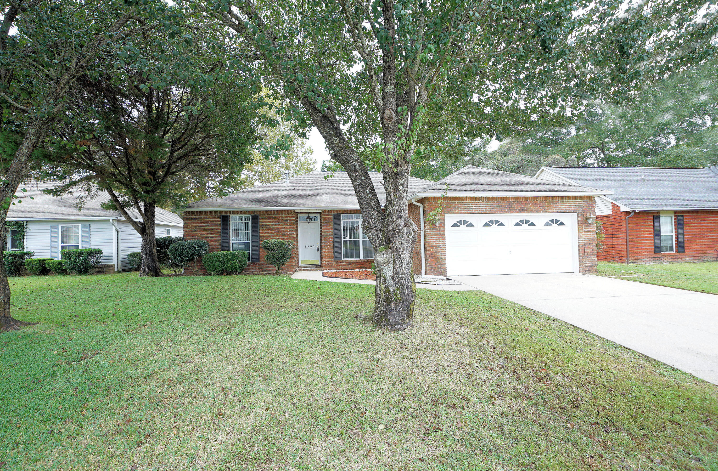 Charming, Warm and Elegant!  This hidden treasure conveniently located in Bluewater Bay with the ability to walk or bike to the grocery store, casual cup of coffee or the perfect meal and the best bonus is the elementary school is close by within walking distance or a great bike ride giving you more time for what you enjoy.  This 3 bedroom and 2 bath home can accommodate any lifestyle with no detail being overlooked with new renovations of new flooring to include tile, carpet and new paint making its palette ready for any colors or décor.  Upon entering the front door this home says welcome with this open/livable floor plan that lives bigger than square footage with high ceilings with a formal dining room adjacent to the kitchen and great room giving an easy flow for those extended parties or holiday feasts.  The kitchen has a work bar making any meal prep easy, a kitchen that offers plenty of cabinets and space for any chef's delight with an eat-in kitchen for those leisurely breakfast mornings.  The master suite completed with garden tub and shower and his and her vanity and new tile flooring. The privacy fenced backyard is perfect for any entertainment to include a screened porch perfect for those weekend grilling or fellowship gathering.  This Parkwood is your home just waiting for you no matter what season of life you are in.  Home is situated on a cul-de-sac with no thorough traffic giving you Peace of Mind.... Did I tell you that you are just a bridge from paradise, the mid-bay ridge gives you the opportunity of a vacation at any time with sugar white sand, emerald, green waters and some of the best restaurants with a view to send your selfies to all your friends tempting them to come visit......