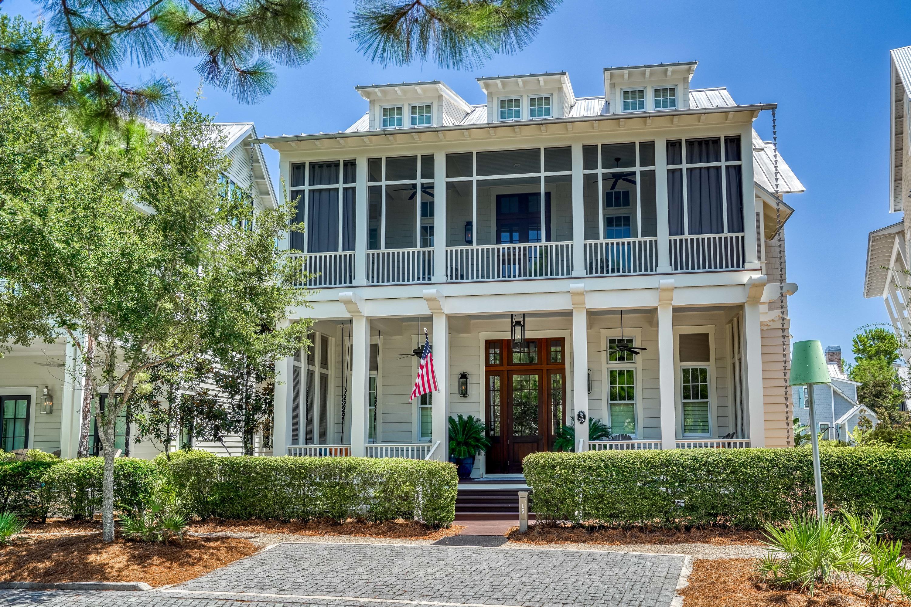 A home with a story to tell in each room, this WaterColor masterpiece stuns from the moment you walk through the front door. Every detail has been meticulously curated resulting in a true artisan space that feels like a historic home yet with every modern convenience imaginable. A 4BR main home and 1BR carriage home with a bunk room share a bricked courtyard and a covered outdoor living area with TV and wet bar. Inside, reclaimed wood and beams, salvaged brick, iron accents and custom lighting by Eloise Pickard create a warm and welcoming rustic atmosphere. The open concept living and dining area is anchored by a showpiece brick fireplace with custom shuttered cabinets. A highlight of the dining room is the stunning chandelier created from an antique hay rake wheel. The stories continue... A brick-lined archway frames the gourmet kitchen with a red oak center island, a custom-built range hood crafted from antique cypress, Thermador appliances, white quartz-surfacing countertops and custom cabinetry with a mix of suspended open shelving. A large walk-in pantry completes this perfect kitchen. Venetian plaster walls are paired with reclaimed shiplap walls throughout while the heart pine floors have been expertly sanded to create the perfect underfoot texture. The first-floor master suite is a true sanctuary with a morning bar, sitting area and custom walk-in closet. Barn doors salvaged from New Orleans open to the master bathroom with separate soaking tub, large walk-in shower and dual vanities. A mud room, office area, laundry room and two half bathrooms complete the first floor. On the second level, find a morning bar and desk area along with three comfortable guest suites, all with king beds and private bathrooms. Each guest room opens to a spacious screened porch with custom bed swings made of antique shutters and plenty of lounge space overlooking the private courtyard. Two covered front porches also feature bed swings and beautiful community views overlooking the Frog Pool. The carriage home offers a private bedroom, a kitchenette, living area and bunk room  perfect for guests. A two-car garage provides ample storage for beach toys, golf cart and parking with additional driveway parking. Architect Paul Geary and Interior Designer Courtney Dickey assisted in creating this private family retreat which is the epitome of craftsmanship and has been lovingly cared for and immaculately kept. Sold fully furnished and move-in ready, it awaits a new family or vacationers to create cherished Gulfside memories. 
Located on 499 acres in the renowned South Walton beaches, WaterColor was created with families in mind and offers the charm of small-town life. Exceptional community amenities include six beautiful swimming pools, a recently expanded Gulf front beach club, nature trails, a Boathouse offering kayaking, canoeing and paddle boarding, a fitness center, outstanding tennis facility, Camp WaterColor for kids with lazy river and waterslide, parks and green spaces.