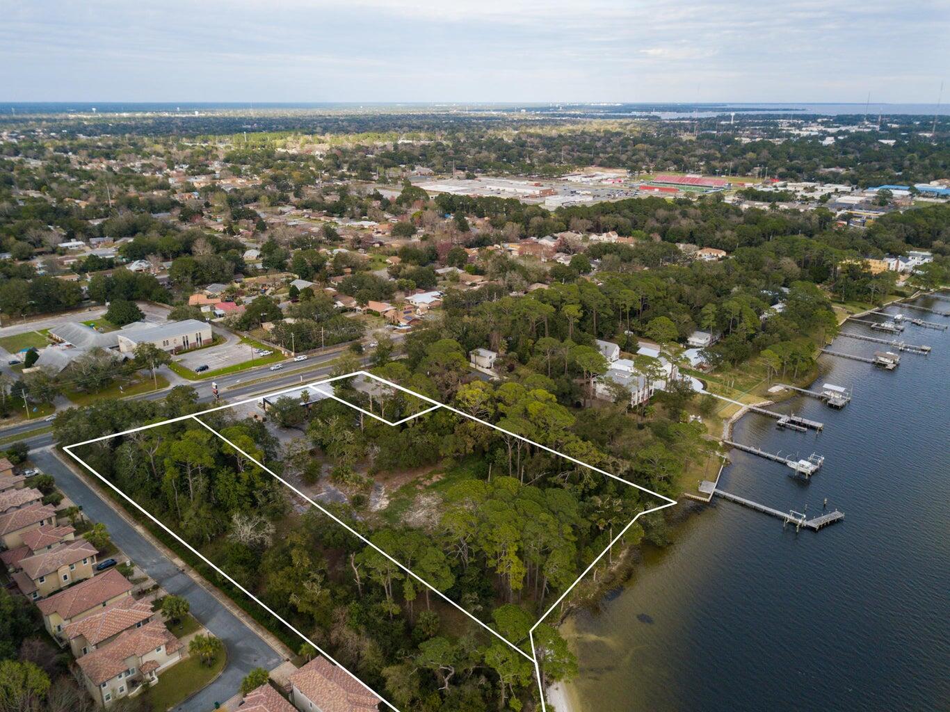 Discover an unparalleled waterfront property offering endless possibilities for development. This rare gem consists of three adjacent parcels spanning over 400 feet of pristine water frontage, creating an exceptional opportunity for investors, developers, or visionary buyers.

Situated on 5 acres of prime land, this property boasts tremendous potential for commercial use or rezoning for residential development. Whether you envision a luxury waterfront community, an exclusive private estate, or a thriving commercial venture, this location provides the perfect canvas to bring your vision to life.

Adding to its appeal, this property has already been approved for condominium development, presenting a seamless opportunity for those looking to capitalize on a high-demand market.