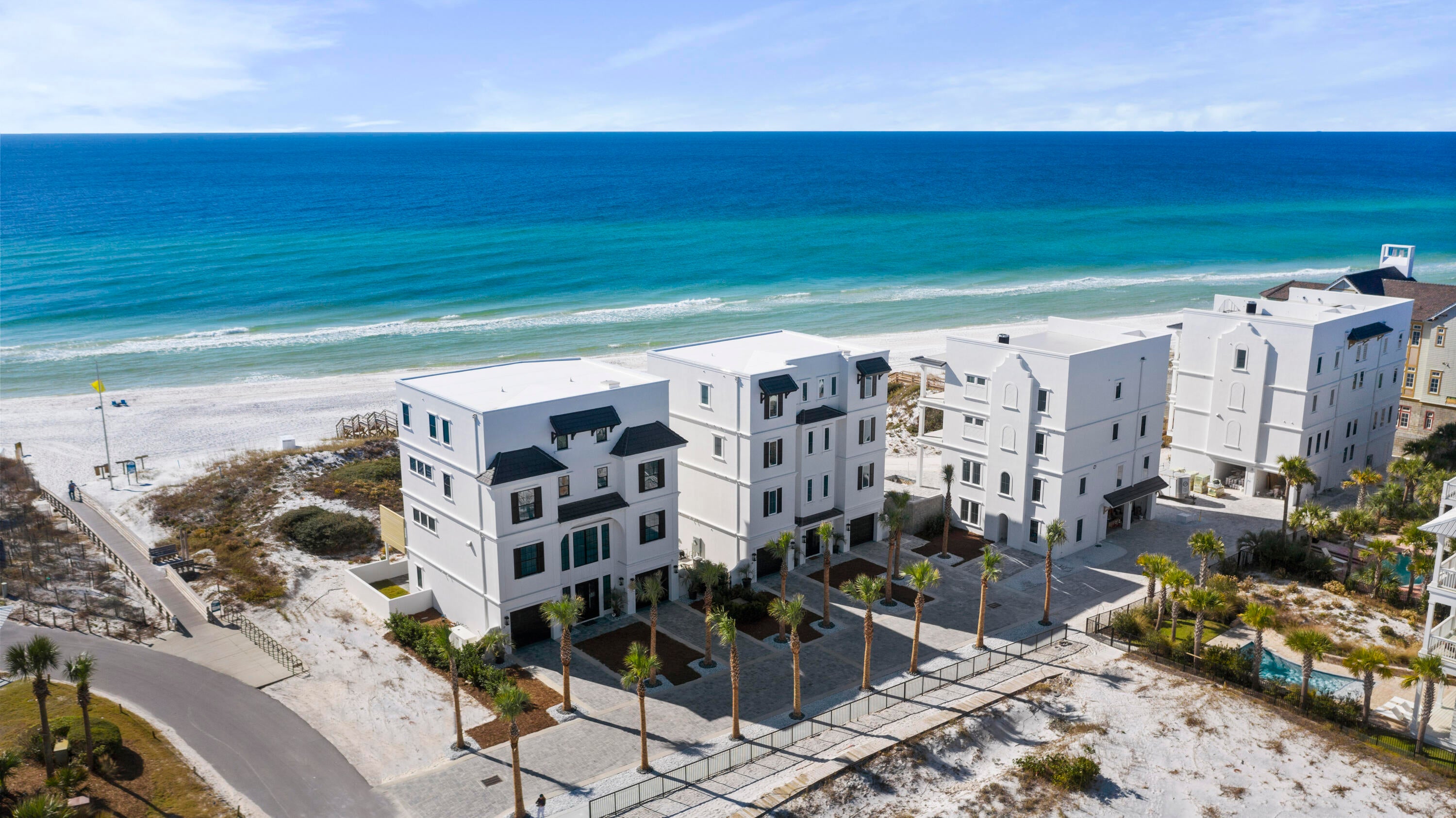 Exceptional new construction Gulf front home that exemplifies true luxury. Even the street name itself ''Azzurro'' means blue in Italian to mirror the crystal clear blue waters of the Gulf of Mexico. This 7-bedroom home boasts 5,218 sq. ft. and is situated on a 1/2 acre lot with a private dune walkover to the beach, 62 feet of Gulf frontage and plentiful outdoor areas including the elevated Gulf front pool on the second level. Superb design and attention to detail is evident by Eric Craig of B. Design's approach. There is a true flow to the home along with beautiful architectural lines, 10-11 ft. ceilings and stunning finishes including Quartz, porcelain tile and custom mosaic work, shiplap, whitewashed spruce ceilings, Kohler fixtures (majority) and unique lighting throughout the home. With ICF construction on the first floor, dune protection, great elevation, superior insulation, 4 AC units seer 18 with built in dehumidifiers, tankless hot water heaters, central vacuum, security system, smart features and 2-car garage with plenty of exterior parking make this home a prime choice. The black shutters, garage doors and trim against the crisp white exterior create a nice contrast and unique look. When you walk into the first floor, there is beautiful decorative tile in the welcoming foyer that flows into a living area with direct access to a fantastic paver deck ideal for a dining or entertainment area or even an outdoor pool table. There is additional storage under the home or to the right for all your beach gear that completes coastal living - kayaks, paddle boards and bikes. Also on the first floor is a custom bunk room with lighting by each, a cage fan and small closet area with built-in shelving. There is an incredible bathroom with decorative tile flooring, Quartz vanity, and walk-in glass shower with magnetic shower head and herringbone tile surround. Laundry is featured on the 1st and 3rd levels and the pool bath and wet bar complete with Sub Zero beverage fridge makes entertaining easy right off the beach. There is an elevator with tile and wood panels or beautiful wooden stairs to the upper levels. The second floor encompasses the great room and stunning dining area facing the Gulf, state-of-the-art kitchen and a bedroom with an en-suite bathroom and additional half bath for convenience. Capture breathtaking Gulf views from the large windows and sliding doors that open up to the covered balcony and elevated heated pool & spa with metallic mosaic detail and beautiful glass surround to maximize the views. There is plenty of room for loungers or outdoor dining area and wooden privacy walls on each end along with a summer kitchen complete with gas grill. Access the dune walkover directly from the pool deck. The interior kitchen offers top of the line appliances like the stainless steel Sub Zero fridge, additional ice maker and beverage fridge and Wolf dual fuel stove with 8 burner gas cooktop with griddle and electric oven with conventional and convection capabilities. There is beautiful cabinetry - soft close, of course, under mount lighting, granite breakfast bar and countertops and glass subway tile backsplash. Beautiful architectural details are noticed like the whitewashed spruce tongue & groove ceiling over the dining area and coffered ceiling in the living area. The living area is generously sized and has a fantastic LED fireplace, contemporary in styling with glass rocks and colored lighting. The living area is staged with upscale furniture for a warm setting. Wood-like tile is great for easy maintenance by the beach and extends throughout the majority of the home along with clean 8" baseboards and crown molding and plantation shutters on the back and sides of the home. The bedroom on this floor is a good size and a stylish barn door opens up to the en suite bathroom with Quartz vanity and walk-in shower with herringbone subway tile.

Upon the third floor, you extraordinarily have not one but three Gulf front rooms, all with access to the covered balcony! The east room is generously sized with a trayed ceiling and an incredible en suite bathroom with barn door, unique light fixtures, a stunning walk-in shower with custom mosaic tile detail, freestanding tub, double Quartz vanity and large walk-in closet with built-ins. There is a niche off the bedroom which could be a great office or workout room with a door to the balcony. The middle room is being used as a deluxe bunk room with sliders out to the balcony and also has access to a separate bathroom with double vanity and walk-in shower. There is a fantastic laundry room off of this as well with a stackable washer & dryer, beverage center and Quartz counter with cabinetry. Perfect for a coffee and snack station. The west bedroom has sliders out to the balcony, beautiful en suite bathroom with vanity on each side, walk-in shower and large walk-in closet with built-ins. The tile selections in all the bathrooms are truly superb and stand out. Great natural light on this floor and breathtaking views to enjoy.

The top floor exudes relaxation with two master suites and an additional living area overlooking the Gulf with direct access to the balcony. The east master suite is epitome of opulence with an expansive en suite master bathroom with double vanity, freestanding tub and walk-in shower then an immense walk-in closet with tons of storage and even a center island with shelving and Quartz top. Just past the closet is a second master bathroom with a beautiful walk-in shower and additional vanity. The room offers large windows with amazing views, trayed ceiling, and another walk-in closet with windows to the Gulf. The master suite to the west has direct balcony access, a beautiful en suite bath and a walk-in closet. This home has top functionality and storage for full time living but can make the perfect vacation home or rental. It is projected to pull in up to $595,000 annually! Smart features make long distance easy as you can control the temperature, security, pool and garage opener all from your phone. The location is special with a private paver stone street for three Gulf front homes and a Gulf front duplex, three boardwalks and will have large palms for a tropical feel. Seagrove offers many dining and entertainment options and is in close vicinity to Seaside, Alys & Rosemary Beach. Local's favorites like Old Florida Fish House, Buddy's Seafood Market, Beachy Bean Coffee & Coastside 30A are all just a quick bike ride away. Be sure to enjoy Eastern Lake, one of the rare coastal dune lakes just west of the home for fishing, kayaking or paddle boarding in a serene environment. The state park nature trails and paved bike trail are close by too, Deer Lake State Park, and The Hub. Do not miss out on this incredible Gulf front estate and prime investment on 30A.