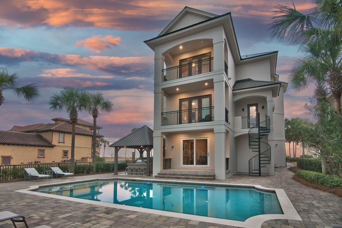Recently renovated and professionally designed & curated, this sleek coastal contemporary masterpiece is prominently situated to capture extraordinary unobstructed gulf views. This is the ultimate beach home ideally situated on the easternmost lot in Grand Palms overlooking the county owned beach frontage; masterfully configured to provide unparalleled amenities and built to last with insulated concrete construction. This exemplary retreat boasts incredible short term rental potential as well as fine curated finishes for second home or permanent living. The layout has been thoughtfully configured to maximize functionality offering ample exterior parking in addition to an oversized two car garage. Notable features include a watermark-built private resort style pool area complete with a covered outdoor summer kitchen & living area with bar seating and outdoor television. There are multiple indoor and outdoor living areas, private commercial grade elevator, dual master suites with exceptional gulf views and adjoining spa like bathrooms with floor to ceiling tile, ample windows, indoor and outdoor surround sound system as well as covered porches on the south elevation allowing for endless gulf vistas. The first floor layout boasts dual bunk rooms, as well as two large bedrooms and adjoining baths as well as a comfortable family room just off the pool deck offering a wet bar and lounge. The second floor is the focal point of indoor living space with a massive open living room featuring panorama glass windows for soaking in gulf views, custom entertainment center and open to the massive dining area facing due south. The ample sized kitchen features floor-to-ceiling custom cabinetry, Sub-Zero appliances and Wolf professional series gas range, walk-in pantry and large center island with gorgeous quartz custom countertops. The second floor also features two full bedrooms with ensuite bathrooms & half bath as well as a spiral staircase access to the outdoor dining area and resort style pool. The third floor features three full bedrooms including dual master suites each featuring soaring 14' vaulted ceilings with pristine gulf views, laundry area and massive open porches offering eastern and western views. This home is well positioned to enjoy all of the world class beaches along scenic highway 98 as well as Destin's restaurants, shopping, dining and outstanding local entertainment. Grand Palms owner's enjoy all of the amenities of Destiny S/D including the community pool area, clubhouse, tennis courts and community grounds.