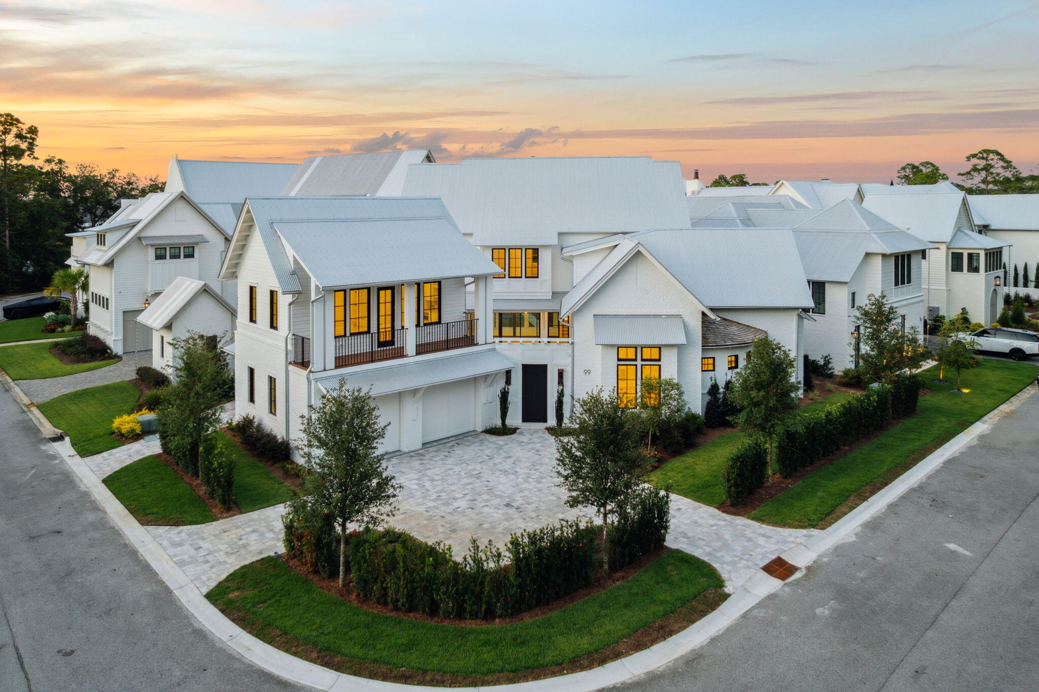 99 Perrin stands as a newly completed lakefront estate within the coveted enclave of Churchill Oaks, where Southern architectural tradition meets refined modern craftsmanship in the heart of Santa Rosa Beach.

Spanning more than 5,600 square feet across three elegant levels, the residence offers five bedrooms, five full baths, and two half baths, each space designed with a discerning eye toward proportion, natural light, and seamless flow. Expansive porches extend living outward, while a private pool anchors the outdoor retreat. A two-car garage, plus separate golf cart garage completes the layout, balancing quiet comfort with effortless entertaining.

What defines this home is its setting. Churchill Oaks is more than a neighborhood, it is a private architectural enclave... where over 40 acres of preserved green space integrate nature into daily life. Residents enjoy exclusive amenities including a bayfront clubhouse, resort-style pool, fitness center, and deepwater marina, all thoughtfully designed to cultivate privacy, permanence, and peace.