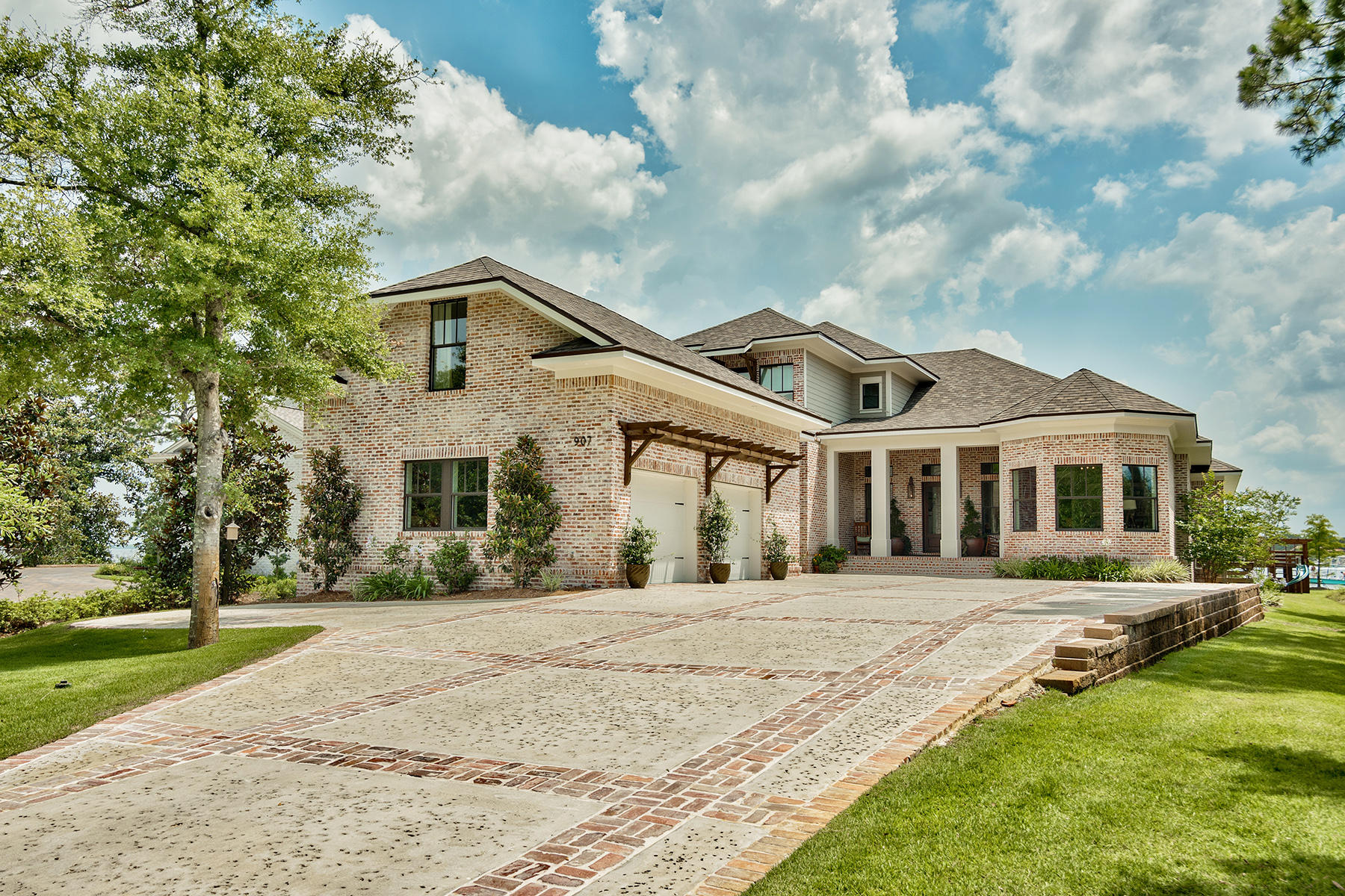 Discover one of Destin's most exquisite custom built homes that has been decorated to perfection. With stunning architectural details throughout, this gracious 5 bedroom, 6 bathroom waterfront home is situated in a gated community boasting expansive views. The spacious and open floor plan includes high ceilings, separate dining room, breakfast nook and great room, ideal for entertaining. The heart of the home is the chef's kitchen, with Thermador kitchen appliances, large kitchen island and butler's pantry. The waterfront master retreat has a gas fireplace and ensuite master bath with steam shower and custom walk in closet. Step outside to enjoy the backyard oasis which includes a saltwater pool with hot tub, sun tanning ledge, and dock with two boat lifts. The covered outdoor kitchen includes a coyote grill and refrigerator in addition to an open outdoor kitchen area with a wood burning fireplace and Big Green Egg. With no detail overlooked, this home offers impact resistant doors and windows, reclaimed brick both inside and outside, security system and custom speakers throughout the home as well as front and back porch areas.