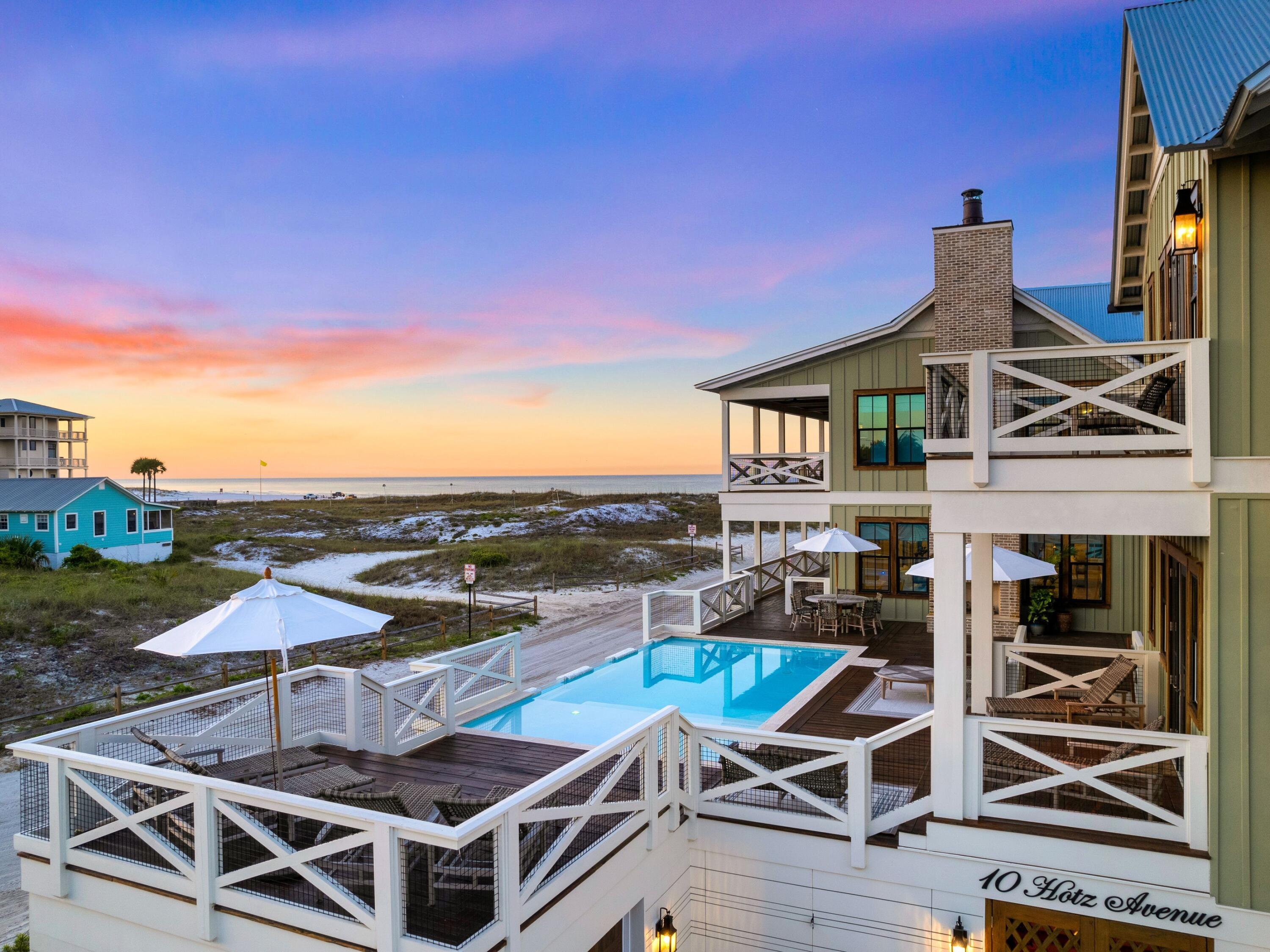 A harmonious fusion of historical significance and modern elements found in a new build, ''The Grayton House'' embodies everything quintessential about the charming beach community in which it resides. Originally built in 1895 by McCaskill Lumber Company, the historic home has seen many facelifts throughout its time on iconic Hotz Avenue until its full potential was realized by bespoke builder Daniel Brock in 2022. Modern-day comforts permeate the seven-bedroom, eight-and-a-half-bath home, starting with the security of a compound-style courtyard system, heated and cooled four-car-plus-golf-cart garage, and second-story private pool overlooking protected Grayton Beach State Park and the Gulf of Mexico. Entertaining multi-generations was the inspiration behind the property's layout, with importance placed on spacious outdoor and indoor living areas, culinary spaces and plentiful covered decks. Preserving the history of "The Washaway" was at the core of all rehabilitation and restructuring work when crafting this modern-day home, with every reusable element from the original structure incorporated throughout the showcase. Floor joists from 130 years ago now adorn the cathedral vaulted ceilings in custom spaces throughout the home, while original rafters and siding were reimagined as expansive dining tables in the alfresco space. Luxurious elements adorn the property, adding doses of luxe furnishings, textiles and elements to each space of the home. 

Fisher & Paykel appliances anchor the chef-ready and well-appointed kitchen, while custom hand-hewn wainscotting in the living room and custom-laid tile craft enchanting spaces to embrace the very best of life along the coast. A ground-level game room with turf flooring and a full bath is the source of endless smiles and convenience with fully locking entry doors for private accommodations only footsteps from the sugar sands of Grayton Beach. Effortlessly walkable to everything in downtown Grayton Beach such as Chiringo, the iconic Red Bar, Tribe Kelley Surf Post and the Western Lake boat launch, The Grayton House truly is the epitome of 30A living.