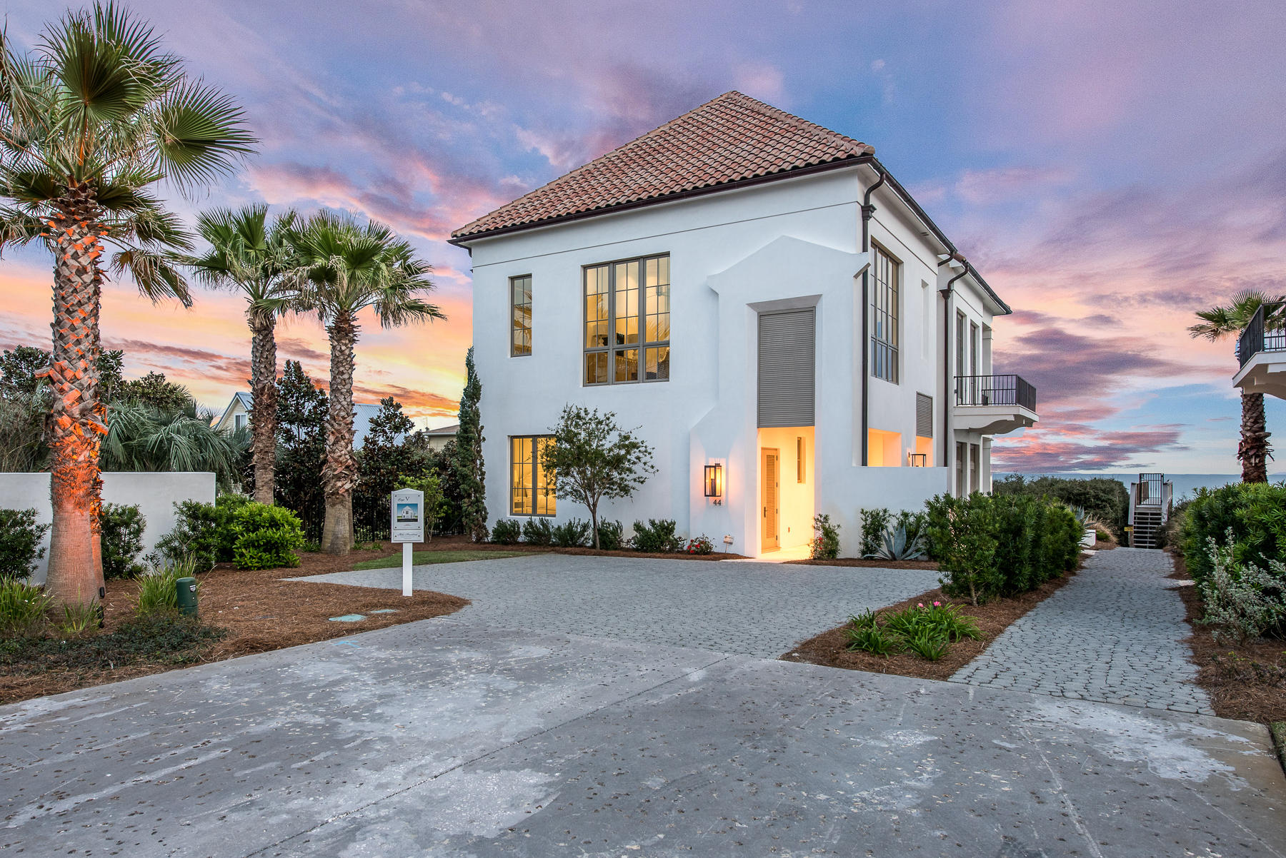 Exquisite beach front home in exclusive E-scape community of Inlet Beach. The private gated 4 home community of Escape holds only Gulf front homes of exceptional quality. Built with fortified construction and highest energy efficiency standards, and designed by A Boheme Design of Rosemary Beach, this waterfront home is comprised of only top-of-the-line materials and finishes. Subzero and Wolf appliances fill the chef's kitchen, and you'll find all stone tile and brushed wood flooring throughout. The unsurpassed views of the Gulf can be enjoyed from each of the homes 3 levels. The 3rd level exclusively holds the master suite, oversized master bath and closet, and a private balcony. The 2nd level holds the home's kitchen, living area, an additional bedroom, as well as a flex room that could be used as a bunk room, media room, or office. The ground level has bedrooms  with en suite baths. Each floor holds it's own laundry facilities for ultimate convenience. You will have private gated beach access, a private parking garage, and 1/4 ownership of the gorgeous and unique rooftop pool, outdoor kitchen and indoor/outdoor common areas. 
All information is deemed to be accurate but is not guaranteed. Buyer to verify.