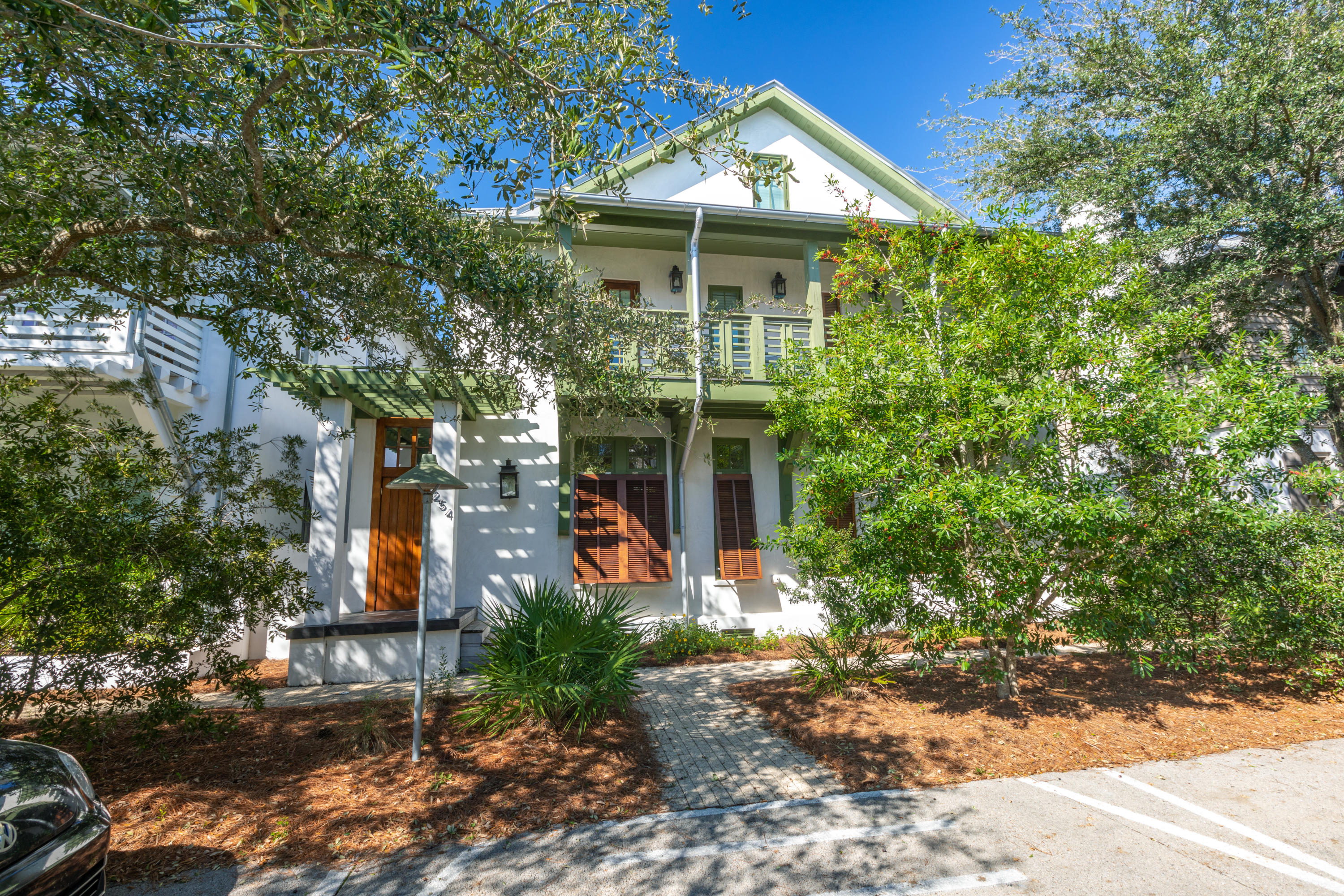 A must see Park Side  Rosemary Beach home with a spectacular courtyard offering a resort-like atmosphere. Ample seating and lounging areas surround an infinity hot tub and large pool with multiple waterfalls and lights. A porch swing, dining area, grilling area and beautiful landscaping enhance the courtyard atmosphere.  The main house features exposed wood beams, high ceilings, beautiful oak flooring, and an iPad compatible pool and spa system.  The expansive gourmet kitchen with granite countertops, top of the line GE Monogram, appliances, ice maker, beverage refrigerator, plentiful storage and adjoining dining area provide the perfect place for the chef to entertain. Relax in the living area featuring high coffered ceilings, built-in bookshelves and window benches. French doors in both the kitchen/dining area and the living area allow easy access to the gorgeous courtyard.  You will find a full size laundry room complete with a utility sink and even more additional storage on the first level of the home.  
The second level of the home features the master bedroom and two additional bedrooms with well appointed en-suite baths and large closets.  The master bath features a separate jetted tub, large shower and dual vanities.  The master has two porches, one features rocking chair sand overlooks the community Cabana Pool.  The second porch is an expansive screened sleeping porch offering the ultimate in relaxation.  The third level of the home will delight children with built in storage and bunks that sleep four comfortably.  There is also a full bath on the third level.  
The Carriage house is located on the opposite end of the courtyard and above the two-car garage.  In addition to privacy, carriage house guests will enjoy the well-appointed kitchen with marble countertops and breakfast bar and the vaulted living area with a queen sleeper sofa.  The bedroom features a king bed and is adjacent to the lovely full bath.  Additional carriage house features include a separate porch, Sonos surround sound system, and full size washer and dryer.
This beautiful and meticulously maintained home offers over 1,700 square feet of covered outdoor space to enjoy year round. This is a home you simply do not want to miss.