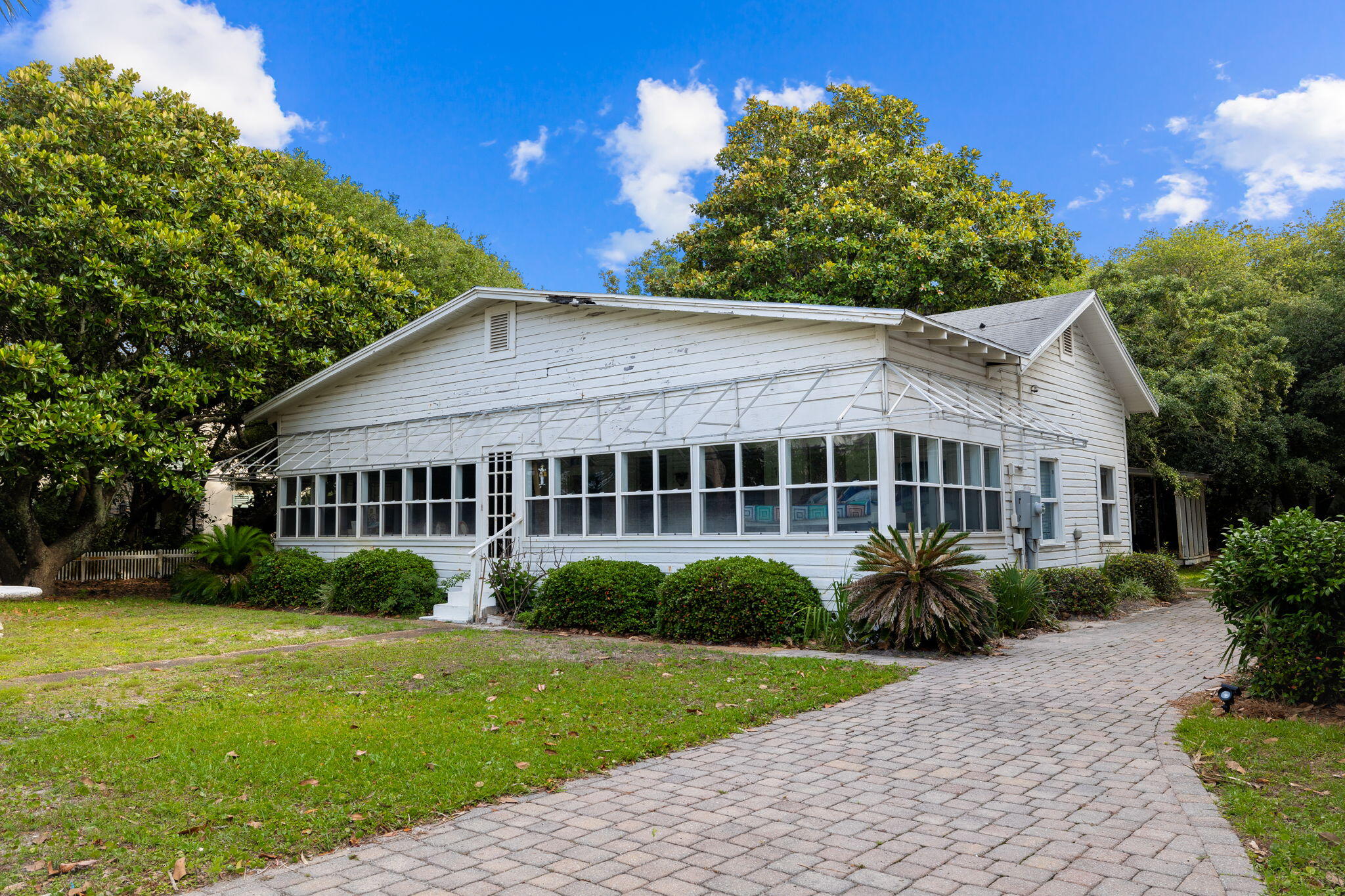 A rare opportunity has arisen to own an oversized corner lot on Live Oak Street and 30A  in the coveted Old Seagrove neighborhood.. This traditional Seagrove Beach Bungalow offers three King bedrooms and two baths. The expansive lot is conveniently located steps from two neighborhood beach accesses and a short stroll to the renowned restaurants and shops of Seaside.
Whether you preserve the existing home or embark on a new development increasing the square footage and incorporating Gulf views. This opportunity is as rare as it is extraordinary.