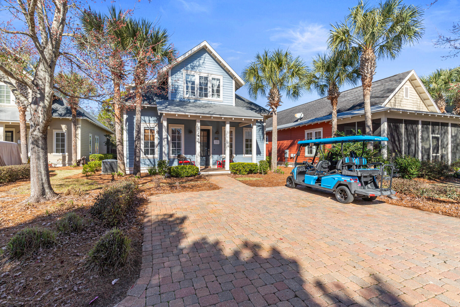 2481 Bungalo Lane features a spacious floor plan, coastal décor, plush furnishings and an oversized screened-in porch with an extended back patio overlooking the backyard! With excellent rental potential, this beautifully appointed beach bungalow offers 4 bedrooms and 4 bathrooms and is conveniently located across the street from the pool and neighborhood putting green, and a few minutes golf cart ride to the beach! This thoughtfully designed home offers the largest floor plan at Bungalos. The main level features an open concept living area and kitchen, and both a primary suite and bunk guest room on the first floor, along with two bathrooms. Upstairs features two bedrooms, two bathrooms, and a second living area!