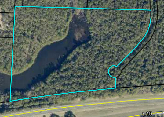 This expansive 19.44 acre property in Okaloosa County offers incredible potential for development, investment, or personal use. With a large pond, this tract of land provides fishing at your fingertips. Situated just a short drive from the heart of Crestview, I-10 and Eglin Air Force Base. The combination of a large land area makes this a rate opportunity that won't last long.