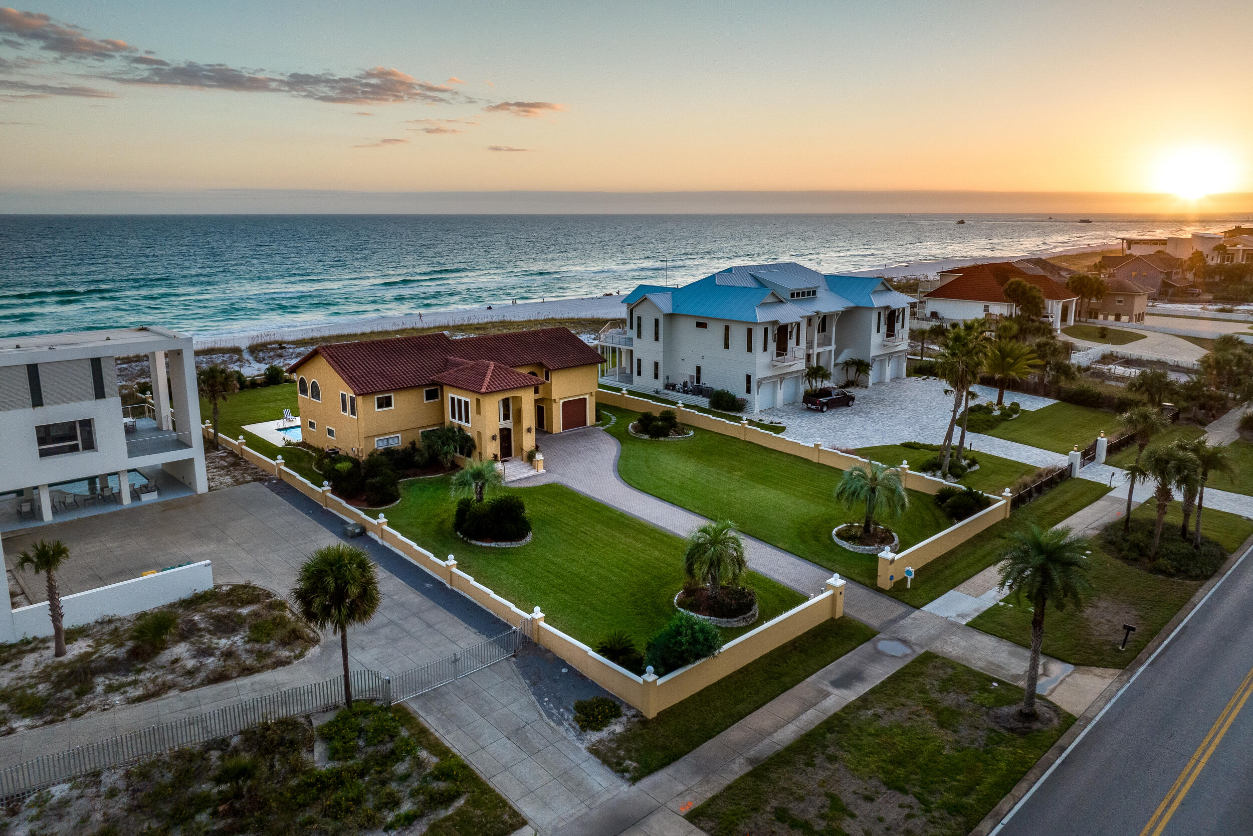 You will be swept up by the Mediterranean styling of this beautiful Gulf front home. Proudly situated on just over one acre, with a 110' expanse of gulf frontage, this property provides plenty of space for family fun! The expansive entry carries you to the next level with sweeping views of the Gulf of Mexico. The second floor offers an open great room, dining area and designer kitchen perfect for entertaining. The enormous master suite features Gulf views, a separate living area, en-suite bathroom with walk in shower, & tray ceiling. Downstairs includes 2 large bedrooms with en-suite baths, plus 2 additional bunk rooms. Outdoors you will find a large in-ground pool with kiddie pool, and expansive lush lawns in front and back. The over sized balconies offer magnificent views of the white sandy beaches and emerald water. Parking is no problem, with 4 garage spaces, plus plenty of driveway space. One acre/110 ft. of prime water front real estate, situated on Destin's beautiful Holiday Isle, is a rare find indeed. The shopping, fine dining, entertainment, and world-class fishing of the Destin harbor district is only steps away. Don't miss this one!