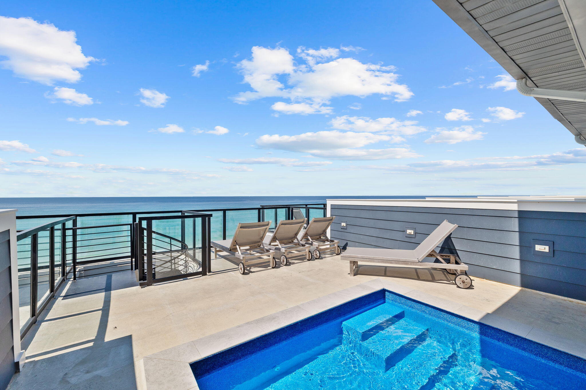Welcome to Henderson Beach Villas, the crown jewel of Crystal Beach and the area's premier new luxury beachfront development. Perched high above the shoreline, this extraordinary four-level residence offers panoramic, unobstructed views of the emerald-green Gulf waters and sugar-white sands from nearly every room.

Expertly designed by the renowned Duce & Co., the home exudes sophistication with curated fixtures, custom finishes, and upscale surfaces throughout. Thoughtfully laid out for both comfort and entertaining, the villa features expansive indoor and outdoor living spaces, including an oversized covered patio, rooftop deck with private pool, home theater, and chef's kitchen.

As you step inside, soaring ceilings and floor-to-ceiling glass draw your eyes to the horizon. The open-concept great room seamlessly blends luxury and livability, anchored by a state-of-the-art kitchen complete with high-end appliances, designer cabinetry, quartz countertops, and a stunning tile backsplash. Slide open the glass doors to your private covered patio on the first levelperfect for shaded lounging with the sound of waves as your backdrop. This floor also includes a guest suite with en-suite bath and a convenient powder room.

The second level offers a tranquil retreat with a junior primary suite featuring a private balcony and breathtaking Gulf views. The spa-inspired en-suite bath includes a dual vanity, soaking tub, and walk-in shower. Three additional guest suites, each with generous closet space and private bathrooms, along with the first of two laundry rooms, complete this level.

On the third floor, the primary suite is the pinnacle of luxury, with floor-to-ceiling Gulf views and direct balcony access. The elegant en-suite bathroom features a dual vanity and an expansive walk-in shower. Down the hall, a private home theater offers a cozy escape with tiered recliner seating, a gaming table, and a large flat-screen TVideal for movie nights or rainy-day entertainment. Another guest suite, bathroom, and laundry room are also located here.

The show-stopping rooftop level is an entertainer's dream, offering a spacious deck with panoramic views, a covered lounge area with TV, and a private rooftop pool overlooking the Gulfperfect for sunset cocktails and relaxed evenings under the stars.

Henderson Beach Villas is an exclusive 10-unit, gated community offering private beach access, a dedicated walkover, and reserved parking. Whether you're seeking a luxurious primary residence, vacation home, or high-performing investment, this exceptional beachfront villa is an opportunity not to be missed.