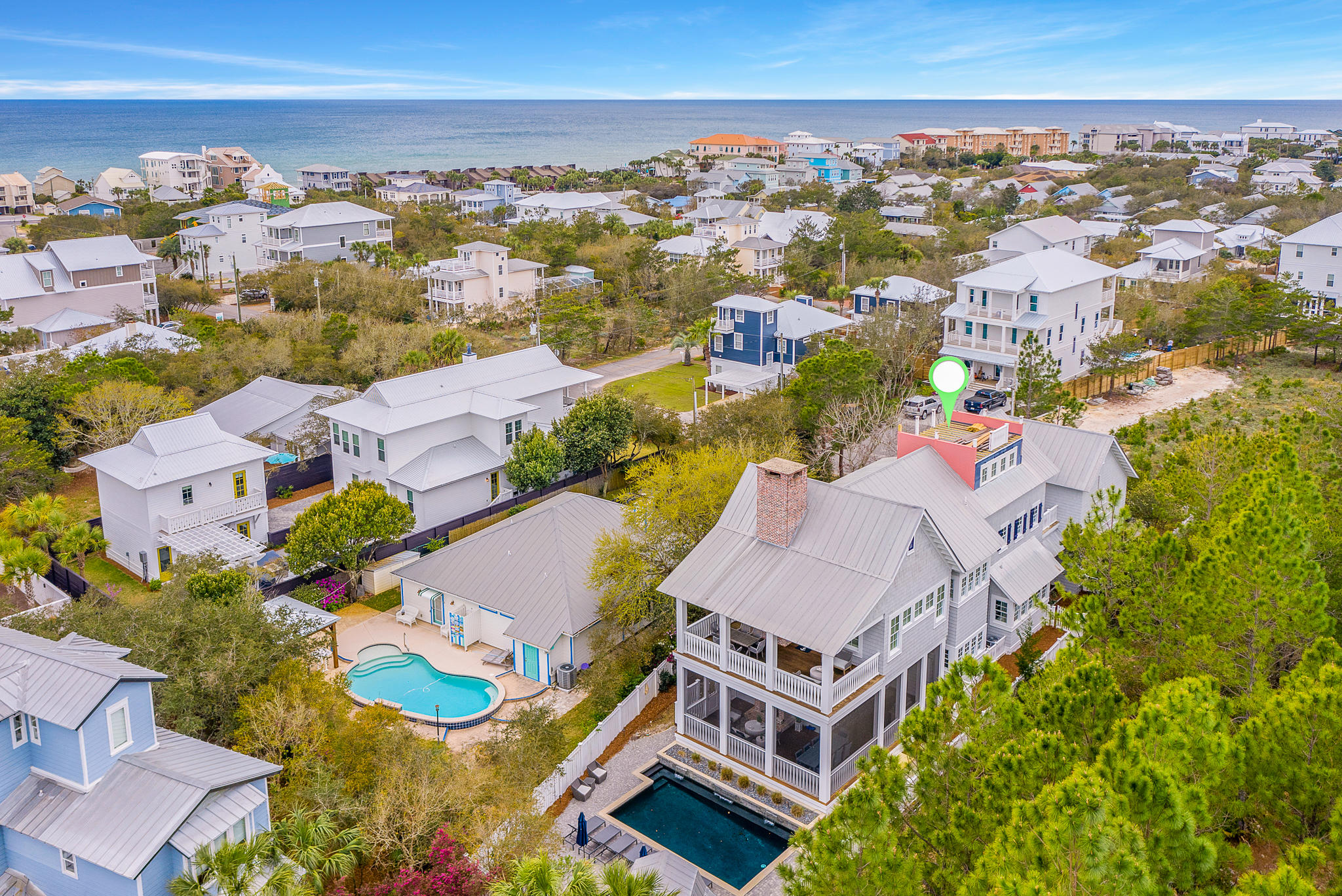 172 A Street is ideally located at the end of a cul-de-sac, with a 175ft wooded buffer which provides a sense of seclusion. This Gambrel-style home is ideally located in the heart of Seacrest, and less than 1,000ft away from deeded beach access. This home features 6 bedrooms, 6 bathrooms, 5,125 square feet, and a private pool. 

This first floor offers a spacious open plan and features a gourmet kitchen, a beautiful custom breakfast nook and bar, an oversized laundry, complete with custom storage bins and a built-in desk, and a guest suite bedroom with full bath. 

The second floor features an oversized master suite, which is complete with a spacious bedroom, sitting area, and a wood burning fireplace. The master bathroom features custom flooring, a stand-alone tub, and a walk-in shower. The second floor also features two more bedrooms taht feature custom shelving in the closets, and custom desks, perfect for homework or crafts. The second floor porch also provides access to the spacious carriage house, complete with large bedroom and full bathroom. 

The third floor features another bedroom, complete wtih Gulf views, custom shelving, and a bunk-room. A ladder on the third floor leads to the rooftop porch, which provides panoramic views of the Gulf, to the South, and Camp Creak Golf Course. 

Enjoy family time on the large screened-in porches that overlook the large salt-water pool and children's play house. Live life how it should and book your showing at 172 A Street today!