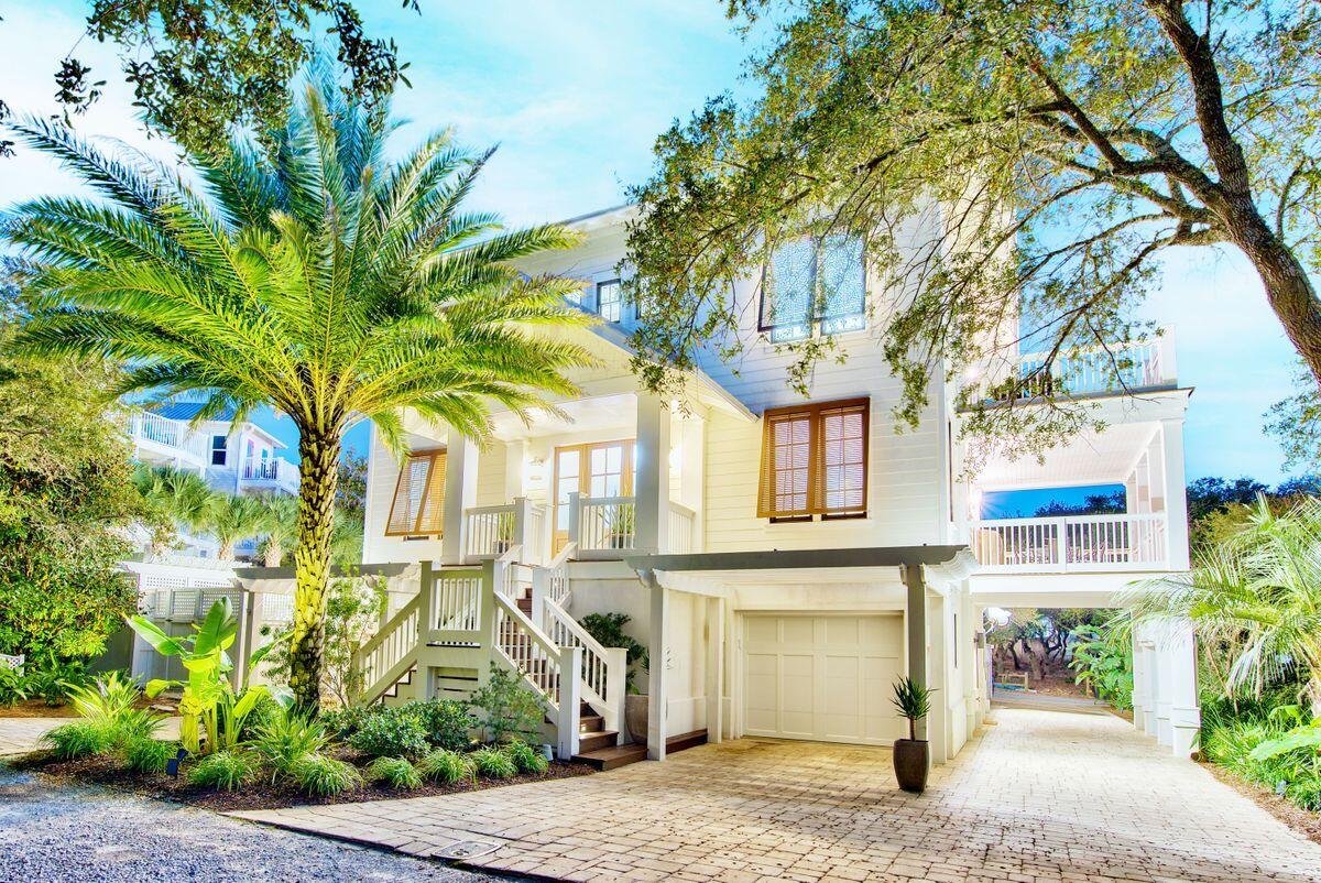 This Geoff Chick-designed beach home is one-of-a-kind for Scenic 30A. The three-story home has four bedrooms and fourt and a half bathrooms, and is nestled on a quiet, private street south of Scenic 30A in Blue Mountain Beach. The current owners installed a salt water pool and ample patio space surrounding the back of the home that is ideal for soaking up the Florida sun, as well as a climate-controlled wine room.  There is a full bar on the ground floor with fold-away doors to allow open-air entertainment. The bar room has an ice machine, beverage coolers and everything a mixologist will need for happy hour. Gulf views abound from the top floor porches. The second floor of the home is the main living and entertaining area with beautiful pine floors and high ceilings. The living and dining areas, as well as the well-appointed kitchen, are all open, so the flow of family get-togethers are not interrupted.  The kitchen is ready for a chef with a Sub Zero refrigerator, Wolf 5-burner gas cook top, stainless GE Monogram oven, microwave, dishwasher and wine cooler. Hanging above the teak kitchen island are three glass pendants, which give off a warm, inviting glow. Off the kitchen is the laundry room with cabinets and storage and a full-size washer and dryer. A handmade, Murano Italian glass chandelier hangs above the dining room table, which seats eight adults comfortably. The living area, with coffered ceiling, is designed for visiting and entertaining with comfortable seating and wall speakers. Two porches are available on the second floor. The first is the grand living porch with speakers and ample seating to take in the golden Florida sunsets over the emerald waters of the Gulf of Mexico. The second porch is on the side of the house and is perfect for grilling and lounging. The home has Loewen windows, which are rated up to 135 mph, and Rannai water heaters. The second floor also has a half bathroom and a guestroom with en suite bathroom. Walking up the pine stairs to the third floor, you come to a landing that has access to the third-floor porch with stunning Gulf views. A swing on the west end of the porch is a romantic spot to take in sunsets. The master bedroom and two guest bedrooms, as well as a small office nook complete the third floor. The guest bedrooms share a Jack-and-Jill bathroom. The spacious master has access to the large porch on the front of the house, as well as a private sun deck for soaking up the warm Florida sun on the west side of the home. Walking into the master bathroom you first come to a sitting area perfect for putting on makeup with a high, wide mirror and plenty of light. The walk-in closet is big enough for full-time living or for those frequent beach retreats. The master bathroom has dual vanities, a soaking tub and a separate shower. The ground level of this home has two garages (one with another washer and dryer), and another full bathroom. Lot dimensions and square footage are approximate and should be verified by the buyer.