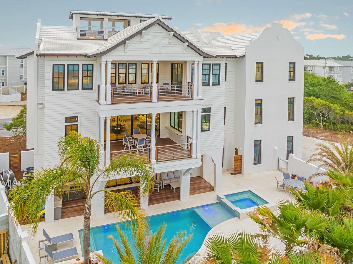Primely located in the heart of Seagrove Beach south of 30A, this pristine second tier offering yields exceptional deeded beach access, beautiful gulf views as well as striking architectural elements designed by Archiscapes & Cronk Duch highlighted by soaring concrete parapet walls and a crisp exterior facade. Masterful building quality abounds with concrete block and poured concrete construction as well as beautiful interior styling including laser cut panel ceilings in the main living area, pecky cypress accents and an extraordinary resort style pool with concrete walled privacy. The essence of this home was designed for families to come together and enjoy the luxury of being in a coastal naturalistic environment. The private parking court yields over 8 parking spaces with access south of 30A. The masterful elevation spans four vertical stories with residential elevator accessibility to three floors for optimal comfort. The first level offers a beautiful vestibule entryway with french limestone floors throughout and a large first floor living area complete with custom bar, bunk bedroom with ensuite as well as direct access to the outdoor courtyard highlighted by an outdoor kitchen, pool bath, and stunning resort pool & spa.

The second level is the epicenter of the home. The chef's kitchen is thoughtfully designed with Meile appliances and custom wood cabinets anchored by a massive center island and finely appointed finishes including a custom vent hood from Thierry Francois along with his signature french oak flooring (which can also be found throughout the home). Meile appliances are standard throughout the kitchen including a gas range, paneled refrigeration, built-in coffee maker and two dishwashers. The open living room off the kitchen is a true paradise with access to expansive south facing porches and 10' glass sliding doors facing the Gulf of Mexico and the private  resort pool. The living room features laser cut oak ceiling panels, ample seating, sleek linear gas fireplace with venetian plaster surround and a custom bar area with built in wine storage, refrigeration and a euro door for entertaining. The second floor also offers a private laundry and ensuite bathrooms for all bedrooms.

The third floor is the primary suite level featuring four separate bedrooms, with expansive gulf views as well as a second laundry room and sitting area. The primary suite has exclusive access to the expansive covered porch as well as the fourth story covered rooftop deck with its private sitting area and endless gulf vistas. The ensuite off the primary bedroom yields a beautiful marble mosaic tile with soaking tub and shower encased in suspended glass and overlooking floor to ceiling glass windows focused on pristine gulf views. The overall design and function of this home is unparalleled on 30A and offers direct beach access without crossing a highway as well as a large 3 car garage. Sanctuary at Seagrove is centrally located on 30A within excellent proximity to Seaside, Watersound and the coveted east end.