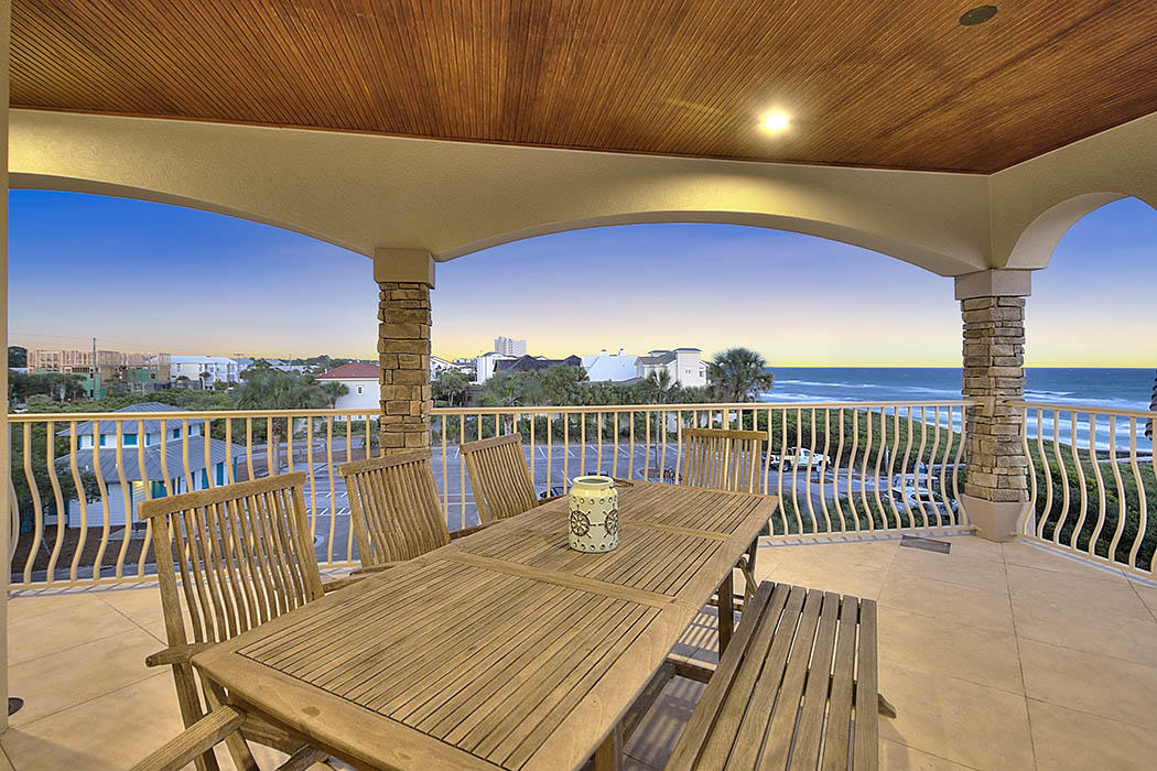 Wake up to breathtaking sunrises. This lovely Seagrove Beach home epitomizes 30A living with its coastal charm and gorgeous gulf views. This 7-bedroom, 6.5 bathroom home spans an impressive 5,200 square feet.
The elegant, stone-paved driveway and custom-built pillars that greet you upon arrival are just the beginnings of what makes this remarkable home unlike any other on 30A. The open floor-plan further accentuates this property's fine craftsmanship and thoughtful design. The first floor boasts a combined living room, dining room and kitchen area that is perfect for entertaining. . Upstairs, four bedrooms await you on the second floor, while the two remaining bedrooms can be found on the third floor with a large family room. The 4th floor rooftop deck offers amazing views.