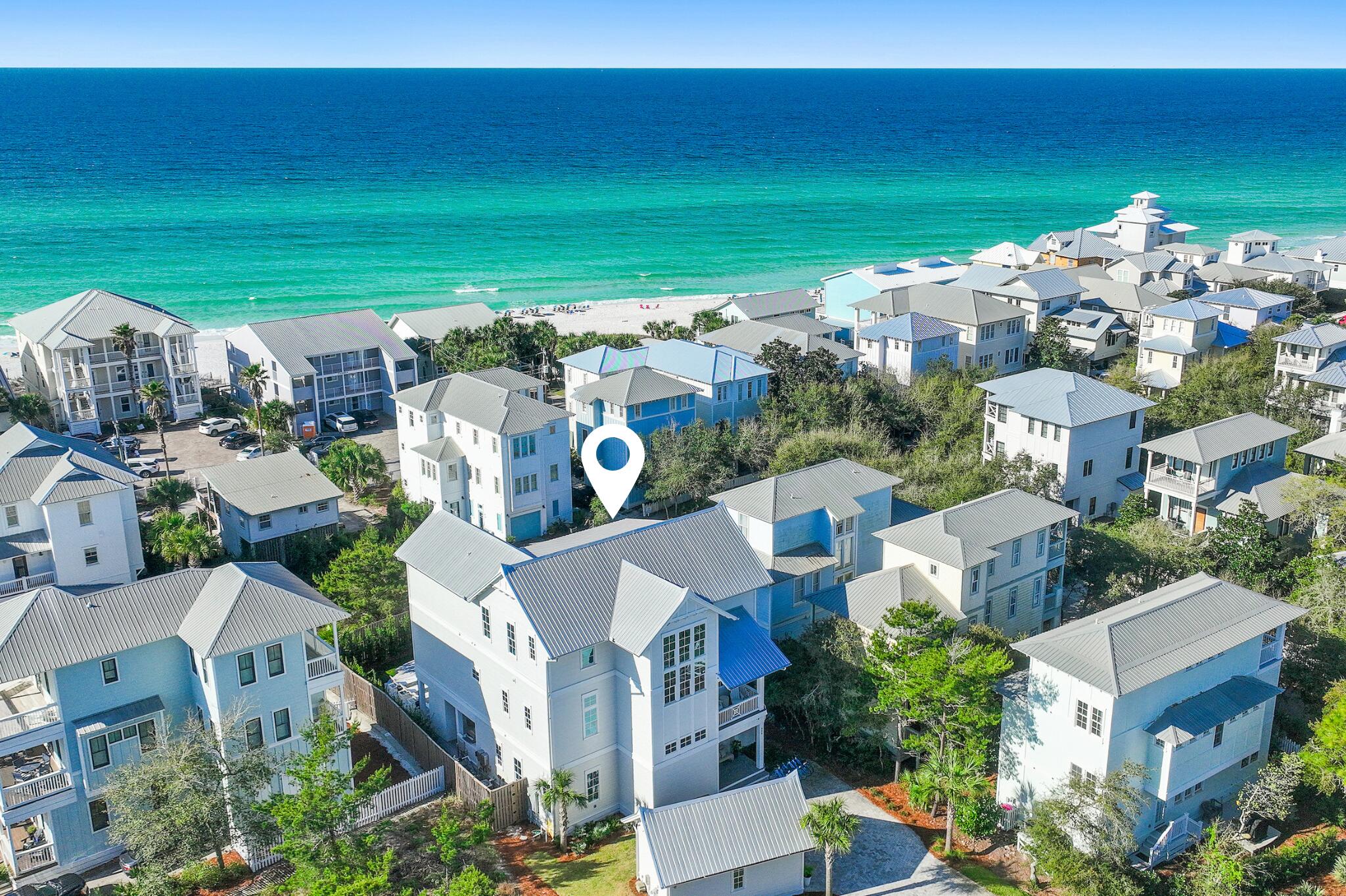 Positioned just seconds from the turquoise waters of the Gulf, this like-new Greg Jazayeri design -- masterfully executed by the renowned Carter Building Company -- seamlessly blends organic aesthetics with breathtaking views of the Gulf and surrounding coastal topography.

Convenience is unmatched, with two nearby beach access points including the renowned Eastern Lake Public Beach Access - boasting over 400' of beachfront across six pristine acres fronting the coastal dune lake - along with the Ramsgate access just around the corner, and ample guest parking. The sought-after Eastern Lake community in Seagrove Beach places residents within easy reach of 30A's acclaimed dining, boutiques, and entertainment, including the new Greenway Station town center. Upon approach, a stately paver driveway bordered by lush vegetation sets the tone for the impressive residence nestled deep on the more than quarter-acre homesite. Step inside to discover soaring ceilings, shiplap-planked walls, and stunning white oak hardwood floors that flow throughout. A first-floor junior suite overlooks the sparkling pool and features a gorgeous spa-inspired bath with dual vanities and stunning floor-to-ceiling tile in the wet room. The adjacent guest suite offers a beautifully appointed ensuite and sits beside the first-floor entertainment room, complete with a wet bar and direct access to the outdoor oasis.
 
The soothing sound of cascading water from the spa into the pool beckons you into a private outdoor retreat designed for both relaxation and entertaining. The heated pool and surrounding living area serves as a true seamless extension of the home's living space -- the perfect setting for gathering with family and friends. Dine al fresco at the fully equipped outdoor kitchen, take a refreshing dip in the pool, or unwind in the shade while the kids play. A custom tabby shell-plastered fireplace provides year-round ambiance, creating an idyllic spot to watch the game while the distant sound of waves drifts in from the shore.
 
Ascending to the second level accessible by both elevator or staircase, warm wood tones, Gulf views, and chic coastal décor deepen the connection to the sugar-white sand just a mere 350' away. The gourmet kitchen is a culinary enthusiast's dream, showcasing stunning marble countertops, an extended island with dual dishwashers, a six-burner Wolf range, Sub-Zero refrigeration, and a dedicated pantry. A covered patio extends the living space further, effortlessly blurring the line between indoors and out. A powder room and an elegantly appointed king bedroom with rich textures and a well-appointed en-suite shower complete the second level.
 
The third-floor primary suite is anchored by a wall of windows framing sweeping Gulf and treetop views, with soaring vaulted ceilings, a dedicated seating area, and an office nook. The sumptuous ensuite delivers a true spa experience with a curbless tiled shower, walk-in closet, and separate water closet. 
 
A third-floor media room serves both the primary suite and guest bunk rooms -- a comfortable hub for relaxation and entertainment. A secondary junior suite, a twin-over-twin bunk room, and a grand bunk room featuring two twin-over-queen bunks round out the third floor, providing flexible sleeping arrangements ideal for families or larger groups. Perched along the roof line, the top floor viewing deck offers the ultimate vantage point to take in the ever-changing palette of color that defines the legendary Emerald Coast sunsets each evening.
 
With projected annual rental revenues exceeding $275,000 and the fully furnished truly turn-key configuration, 332 Eastern Lake Road presents an exceptional opportunity for investors and discerning residents alike. Contact us today to arrange a private viewing and start living the coastal lifestyle you deserve