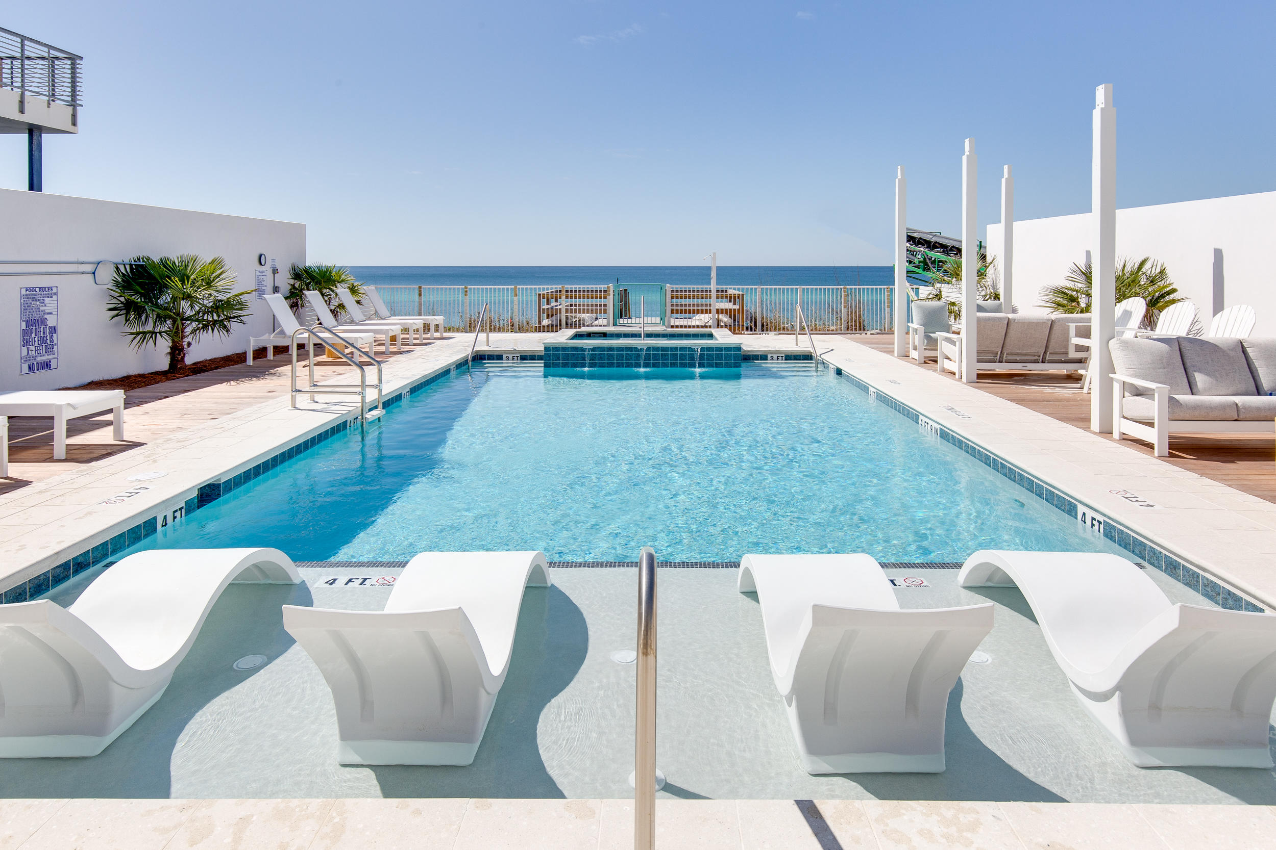 Gulf Front Pool Now Complete! This second floor east corner residence boasts 3,817 square feet and offers a spacious and open living area, massive balcony overlooking 30A and the Gulf, 3 large bedrooms each with their own private bathroom and a full-sized laundry room. This thoughtfully designed floor plan comes furnished and has plenty of room for entertaining friends and family and enjoying the coastal atmosphere from inside or out. An exclusive private beach access, common green space on the Gulfside, and reserved parking spots are just a few of the perks of owning a Viridian Condo. The property is centrally located and is walking/biking distance to shopping, dining and special events along 30A. Opportunities are limited in this unique development