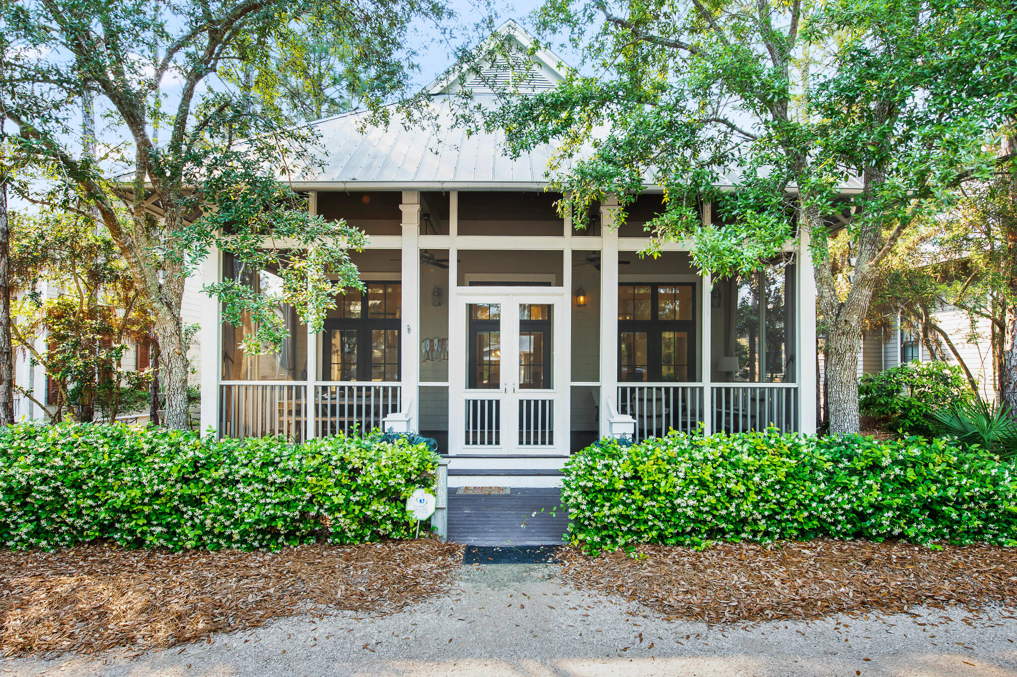 Impeccable Watercolor Camp District Home Designed by noted architect Matt Savoie and built by Romair Construction in a prime location just steps from Camp Watercolor. Strong rental history sleeping 10 with ample covered parking and includes a 2018 6 Seater GEM Car! Home was recently updated by Lovelace Interiors and has a spacious open floor plan with stunning 22-foot tongue and groove wood paneled cathedral ceiling in the main living area, clean coastal white walls and beautiful hardwood floors throughout. The gourmet kitchen boasts new quartz countertops, Sub Zero fridge, Wolf gas range and a wine cooler. First floor master bedroom has access to a side screened in porch, large bathroom with standing shower and whirlpool tub. There are 3 additional bedrooms on the second floor; 2 with King beds and one with full-over-full bunkbed. There is also the potential to add a carriage house with 2 car garage in the rear carport area with Watercolor ARB approval. Quick access to pristine amenities including community pools, tennis courts, fitness center, nature trails, dune lakes, deeded beach access and more.