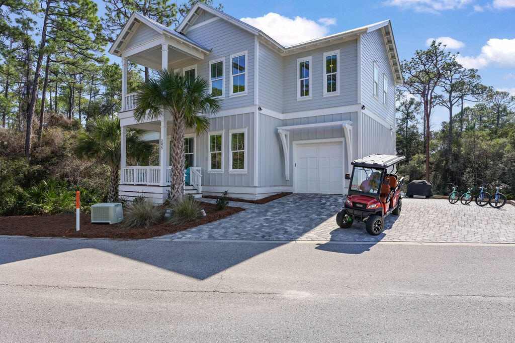 Discover an exceptional opportunity to own a beautifully designed coastal retreat in the highly desirable Seacrest area of Florida's Emerald Coast. Serenity at Treetop combines modern luxury, thoughtful design, and unbeatable location, making it a perfect primary residence, vacation home, or investment property.

Step inside this spacious 5-bedroom, 4.5-bathroom home and experience the effortless flow of open-concept living. The heart of the home features a bright, fully equipped kitchen with stainless steel appliances, a generous island with breakfast bar seating, and abundant storage — ideal for both everyday living and entertaining guests. The adjacent living and dining areas offer plenty of room for family gatherings and relaxed coastal living. Designed with both comfort and style in mind, the interior blends contemporary finishes with warm coastal charm. The primary suite provides a serene retreat with a luxurious ensuite, while additional bedrooms offer flexible sleeping arrangements and privacy for family or guests. A upstairs recreation room adds extra space for fun and relaxation with a shuffleboard table and media setup.

Outdoor living is effortless with multiple spaces to enjoy the temperate Gulf Coast climate  including a covered deck with comfortable seating and outdoor TV, an upper balcony with breezy views, and a welcoming front porch that all set the tone for seaside living.

Situated in a community with a pool and just a short ride to pristine Gulf beaches, bike paths, dining, and shopping along Scenic Highway 30A, this property puts the best of coastal living right at your doorstep. With modern amenities, ample parking, and a golf cart included for neighborhood use, Serenity at Treetop represents a rare blend of comfort, convenience, and lifestyle on Florida's Emerald Coast.