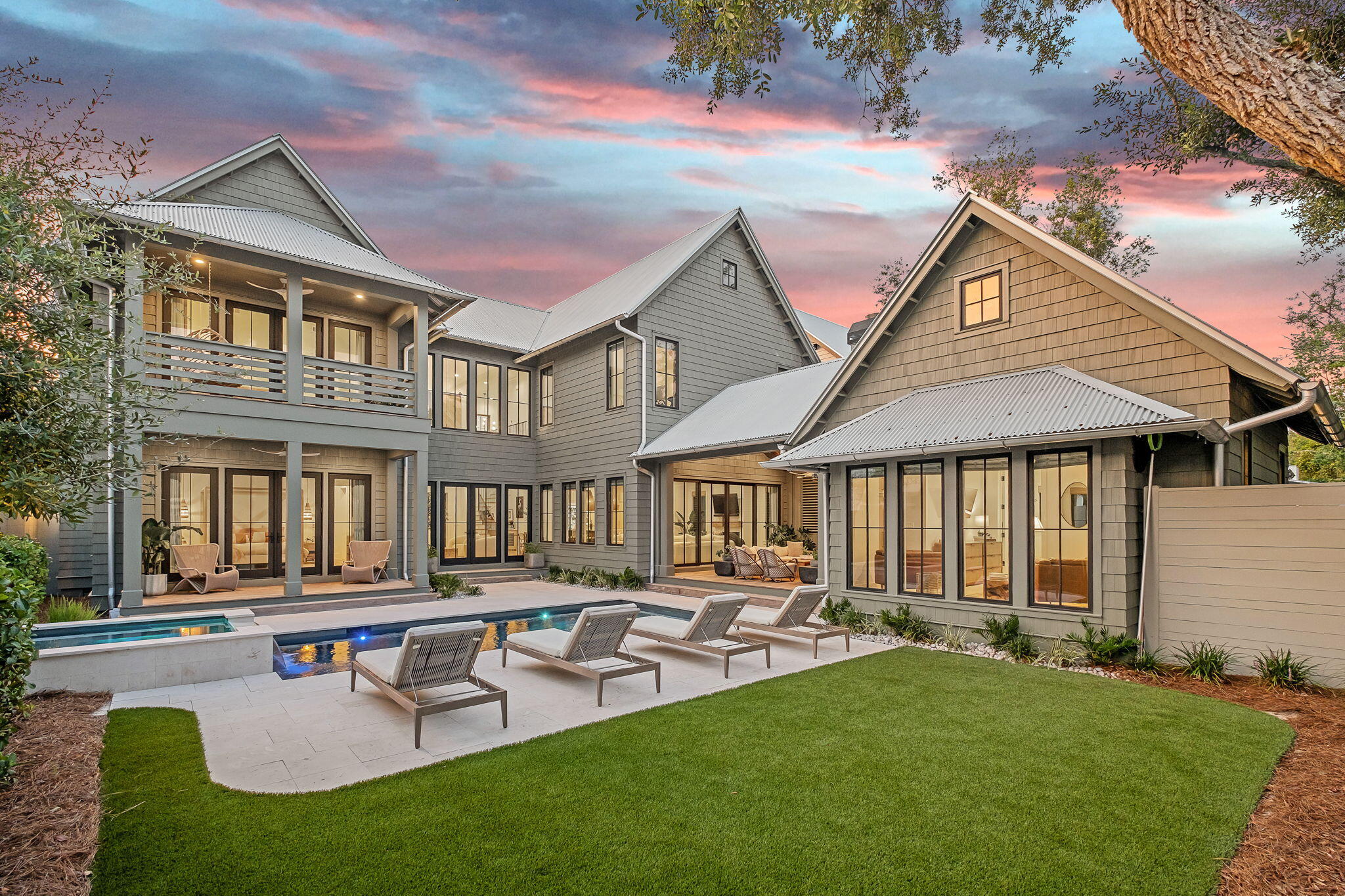 Under contract - Accepting Back up offers.  Exquisite Coastal lake house at 122 Camp Creek Rd South!  Discover the epitome of coastal luxury at 122 Camp Creek Rd South, a custom-designed masterpiece by renowned architect Greg Jazereyi. Nestled on a tranquil, oak-canopied street on the coveted east end of 30A, this serene lakehouse blends sophisticated design with the natural beauty of its surroundings. Positioned just one tier back from the rare Coastal Dune Lake, the property features a brand-new dock directly across the street, offering effortless access to fishing, paddle boarding, kayaking, and the Gulf of Mexico via the lake's outflow. This expansive residence boasts 5 bedrooms, including two luxurious primary suites, and 5.5 bathrooms, designed for ultimate comfort and privacy.  The first floor welcomes you with an open-concept layout, featuring 20-foot ceilings, wood-paneled walls, and large windows that flood the space with natural light. The gourmet kitchen is a chef's dream, appointed with custom natural oak cabinetry, Taj Mahal quartzite countertops, an oversized island, premium Thermador appliances, and a walk-in pantry. The adjacent living room, accented by white oak ceilings and reclaimed beams, and fireplace flows seamlessly to the outdoor living area through a large Eurowall slider. The outdoor oasis is an entertainer's paradise, complete with a covered living area featuring an outdoor fireplace, white oak ceilings, a summer kitchen with a grill, ice machine, and beverage cooler, and a heated saltwater pool and hot tub surrounded by shell stone pavers and low-maintenance artificial turf. Connected to this space is a charming carriage house, offering a cozy guest retreat with shell stone tile floors, vaulted white oak ceilings, a kitchenette, and a full bathroom.

The first-floor primary suite is a spa-like sanctuary, featuring a white-washed pecky cypress ceiling and a luxurious bathroom with Brizo fixtures, organic tiles, a soaking tub, a steam shower, and a spacious walk-in closet. This suite opens directly to the outdoor pool area, enhancing the indoor-outdoor lifestyle. Upstairs, a private office impresses with a pecky cypress herringbone ceiling and custom built-ins, while three additional bedrooms with ensuite bathrooms provide ample space for family or guests. The second primary suite exudes coastal elegance with a vaulted shiplap ceiling, wood beams, and a private deck overlooking the pool.

Additional amenities include multiple laundry rooms, a two-car garage, and proximity to the vibrant communities of Alys Beach and Rosemary Beach, with dining, shopping, and entertainment just minutes away. The opportunity to join the exclusive Watersound Club and the rare access to Camp Creek Lake make this location truly exceptional. This coastal masterpiece combines timeless craftsmanship with modern luxury, offering an unmatched lifestyle on 30A's east end.