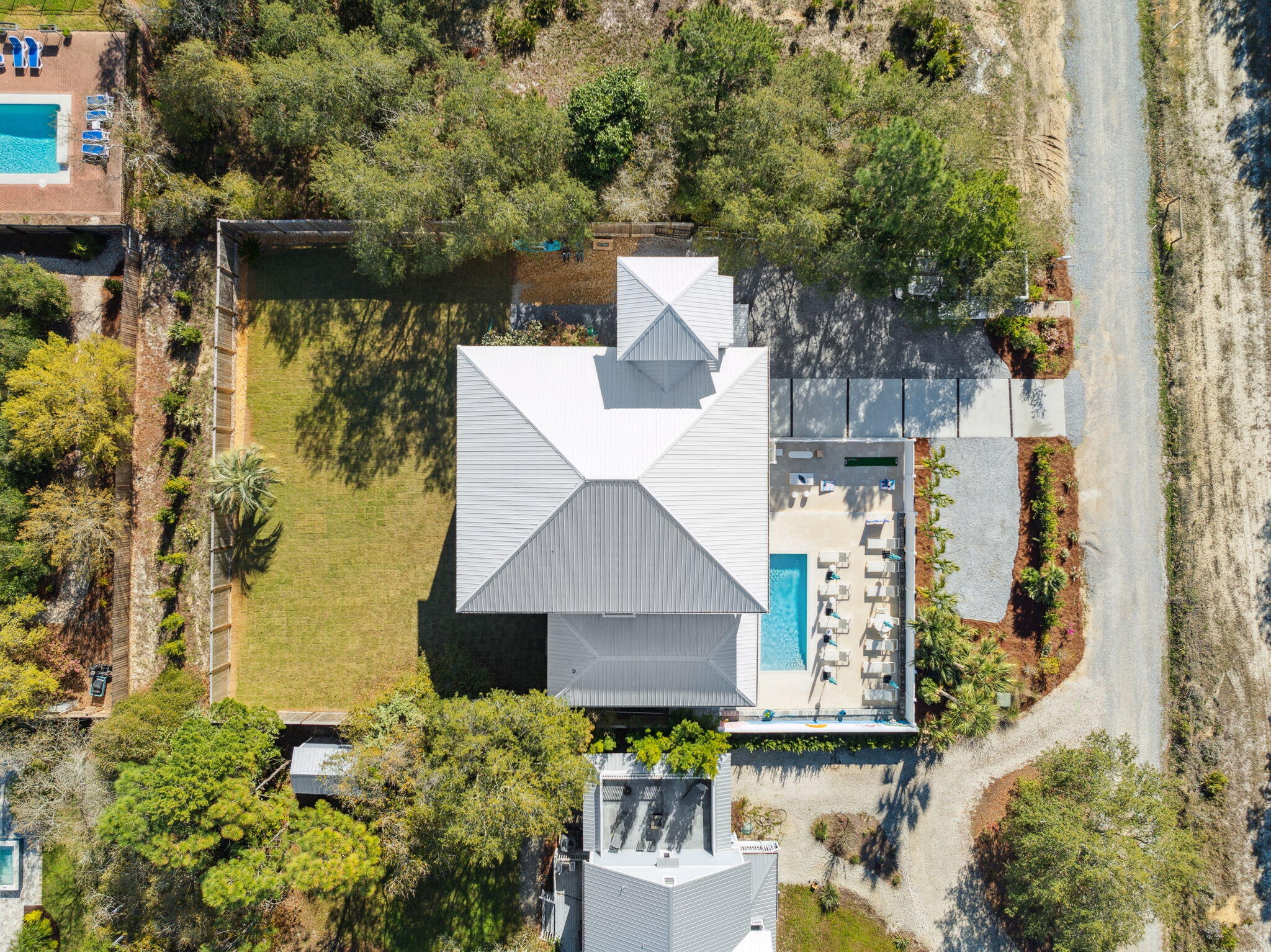 **$318,000+ IN RENTAL REVENUE IN 2024**

**SELLER OFFERING UP TO $50,000 TOWARDS CLOSING COSTS OR 2-1 BUY DOWN OF INTEREST RATE WITH ACCEPTED OFFER**

Positioned on the West End of 30A, this exceptional property combines luxury, privacy, and incredible income potential, making it a true gem for discerning investors. Spanning nearly 6,700 square feet on a generous 1/3-acre lot, this stunning residence generated $318,000+ in rental revenue in 2024, offering one of the best returns you'll find anywhere on 30A. Recent improvements have elevated both form and function, including new flooring, an expanded pool deck, a brand-new paved driveway, refreshed front landscaping for enhanced curb appeal, perimeter privacy fencing and gate, and newly laid sod in the backyard--creating a lush, versatile space perfect for outdoor games, private gatherings, or even the addition of a fire pit or garden.

This expansive home features 10 spacious bedrooms each with its own ensuite bathroom and a total of 11 bathrooms, accommodating over 30 guests comfortably across three beautifully appointed levels. With panoramic views of the Gulf of Mexico from the third level and newly added fourth-floor tower, this residence promises breathtaking sunsets and serene landscapes of Tops'l State Park, which borders the property for enhanced privacy. Multiple expansive, covered balconies provide the perfect vantage point to enjoy the lush natural surroundings. Step outside to an inviting, newly redone private pool area, complete with a spacious patio, a bar, and a poolside kitchen for seamless entertaining. Indoors, guests can enjoy an expansive game room equipped with ping pong, billiards, and arcade games, multiple televisions and seating areas, as well as a dedicated workout and yoga space.

Ideal for both relaxation and entertainment, the home boasts full kitchens on the second and third levels, complemented by the convenient poolside kitchen. Multiple nearby public beach access points with parking make it easy to enjoy the pristine gulf beaches and sugar sand, while local dining at beloved spots like Three Son's BBQ and Stinky's Fish Camp, along with shopping at Gulf Place, are just minutes away. This rare opportunity combines unparalleled comfort and income-generating potential in one of 30A's most desirable locationsmaking it a truly extraordinary investment.