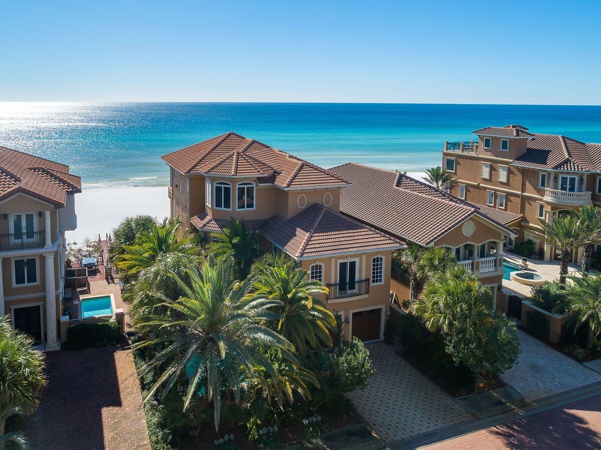 Entered for comp purposes. The courtyard entry opens up to the outdoor kitchen, private beach walkover and south facing deck which serves as the perfect entertaining space overlooking Destiny by the Sea's private beach access.The main foyer entryway offers dramatic double height ceilings and pristine natural lighting from a wall of windows beautifully illuminating the grand spiral staircase which is the focal point of the room. Beyond the foyer is a sizable in-home movie theatre offering handsome decor and adjacent to the private elevator, powder bathroom and full-size laundry room. The main living area occupies the south portion of the first floor and was primely positioned to take full advantage of sweeping gulf views through a wall of floor to ceiling glass windows situated at an elevated vantage point which allows full line of sight to the waves crashing on the sandy shoreline. The chef's kitchen is well equipped with custom wood paneled cabinetry, beautiful granite countertops, Sub-Zero fridge, gas range cooktop and a spacious pantry. The gulf front dining room is adjacent to the formal living area and is anchored by a media console, gas fireplace and stocked wet bar, all of which flows seamlessly onto the rear covered porch which spans the length of the home offering stunning gulf vistas and ample outdoor lounge space. 

The second level features four oversized king bedroom suites each with it's own ensuite bathroom and well equipped with custom window treatments and direct access to the covered reach porches to soak in endless gulf views. The master level is located on the third floor and is easily accessible by the grand staircase as well as the private elevator while offering a spacious office suite complete with gulf views as well as a guest bedroom that overlooks the lush courtyard. The master bedroom is a true retreat offering 180 degree water views from a wall of windows and is well equipped with an oversized walk in closet, master sitting area, private covered porch, finely built media center as well as a spa like master bathroom with dual vanities, soaking tub, walk-in shower, laundry station and water closet. Other notable features include an oversized two-car garage with built-in storage space, finely appointed furnishings throughout as well as custom drapery & window treatments providing optimal comfort and immediate use. This grand marquis is a true sanctuary located in the heart of Destin, Florida overlooking Destiny by the Sea's 3,000' of private beach frontage. This luxurious escape is secluded yet convenient to world class commercial amenities including Legendary Marina, Destin Commons, WholeFoods as well as fabulous local restaurants, boutique shopping and local entertainment.