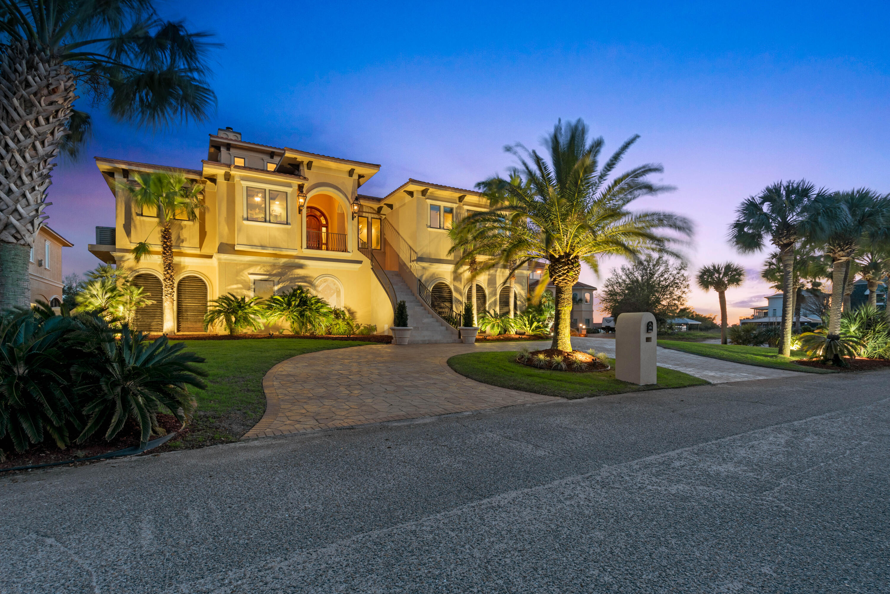 Are you ready to own the lifestyle? This stunning, waterfront gem is a breathtaking combination of superior craftsmanship and tight attention to detail. Not a single expense was spared when constructing this showpiece; using only the highest quality materials on the market, the finest finishes and elevated 12'6' above sea level. The impeccably maintained home features 6 bedrooms, 4 full baths and 2 half baths along with full arcade game room, custom movie theater, full size gym with infrared sauna, whole house generator and sound system, 4 car garage and elevator. The lush, native landscaping showcases the astonishing architecture and just at the top of the staircase rests your custom, mahogany front door. Upon entry you'll notice the beautiful arched tiger wood ceiling followed by the jaw dropping 40ft custom coffered ceilings in the living room. The views are indescribable in words. The entertainer's dream starts in the kitchen with custom cabinets, oversized island, high end appliances including double wolf oven with 8 burner cooktop, Fisher Paykel, Kitchenaid and built in Meile coffee system, walk in pantry, and Butler's bar with wine cooler and custom built in wine cabinet. The kitchen and living flow seamlessly to the outdoor living area featuring a glass fire table, full outdoor kitchen and breathtaking views of the Santa Rosa Sound. If that wasn't enough for entertaining, the downstairs features a custom designed pool with spa, full paver deck, outdoor cabana bar fully equipped with a grill, refrigerator, ice maker, TV and sound system. Enjoy the water from the new 285' dock with 2 separate boat lifts, jet ski lift and 20'x20' platform. The list of top notch features goes on and on making this home a must see for yourself. Call today for your private tour.
