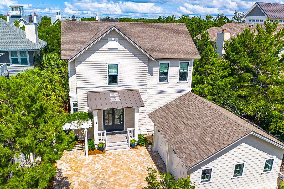 Quality craftsmanship and attention to every detail exude from this magnificent home in the Gulf-front, access controlled neighborhood of WaterSound Beach. Custom built & designed for easy beach living, this home has all the right details: large living/dining/kitchen combo that encompasses the entire rear of the home,  spacious kitchen with large center island, custom cabinetry wolf/sub zero appliances, wine bar and an exorbitant amount of counter space. The main level also includes 2 porches, outdoor grilling area , laundry room and master suite.   The second level of the home boasts 3 large bedrooms, 3 full-baths, a full-size bunk room & a large media/multi-purpose room.  Additional features of this magnificent home include a double garage, outdoor storage closet, Ipe wood decks, shiplap walls, generator, and more. WaterSound Beach has over 1-mile of beach, walking/biking trails/community pool(s) and convenient to all 30A has to offer.