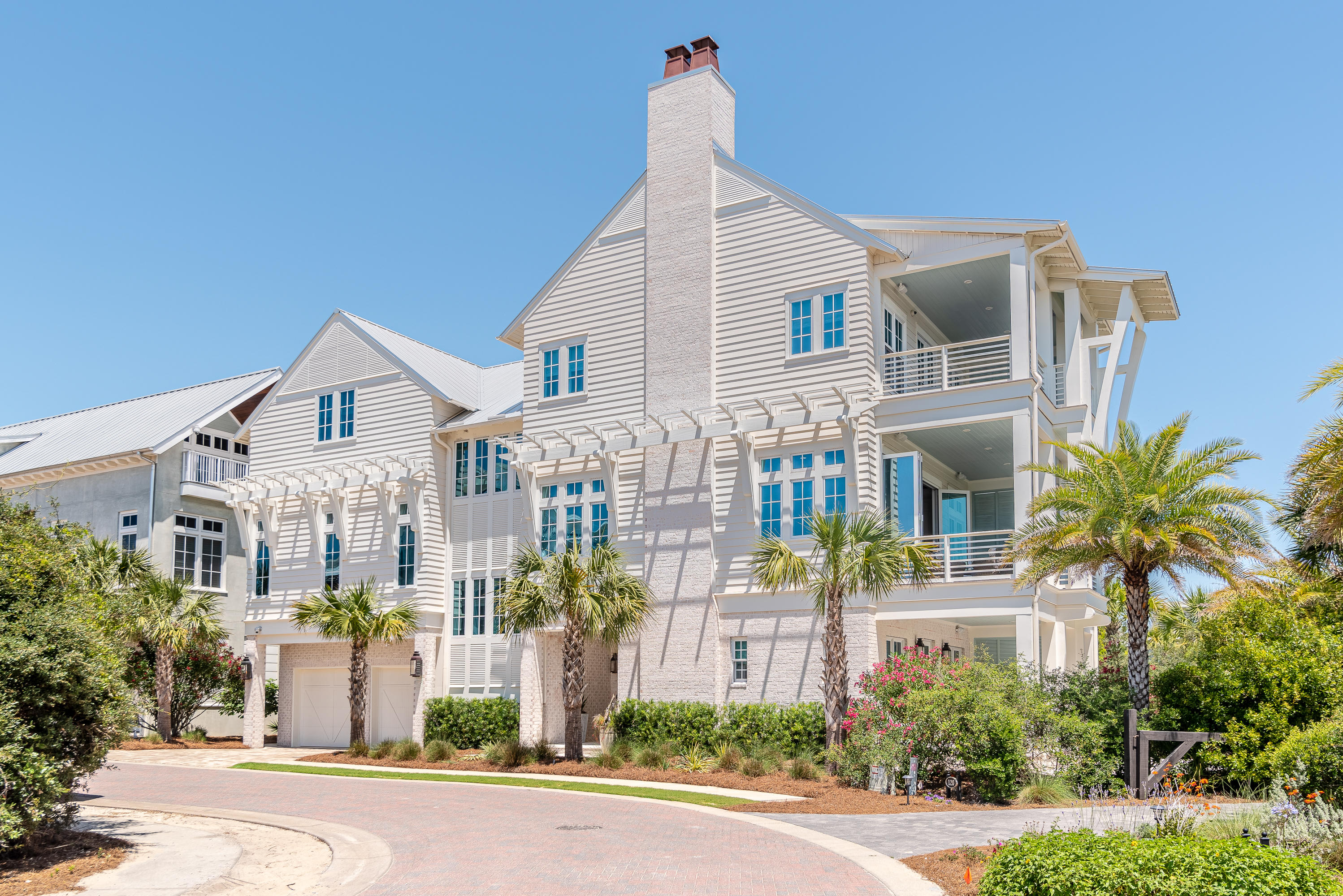 Introducing 130 Heritage Dunes Lane, meticulously planned by award winning Architect, Geoff Chick. Expertly constructed and offered for the first time in the elegant, Gulf front community of Heritage Dunes. Brick pavers lead to the entrance of your gated community with only sixteen home sites. Heritage Dunes is a rental restricted community boasting 375 feet of private beach in the heart of Seagrove. A community pool nestled beachside under the palm trees for your enjoyment with surrounding lounge as well as ideal proximity to all of the world class shopping, dining and entertainment 30A has to offer. Thoughtfully designed as a personal residence, no detail was spared in this custom built, builder owned home. The home is accented with extensive beam and lattice work, all five ensuites feature custom cabinets that have motion light sensors for late night visibility and cypress mantles and barn doors throughout. The ground floor features four sides brick and the second and third floor feature James Hardie Artisan Lap siding. Upon entering the home, you will love the white washed brick accent that blends perfectly with the tasteful shiplap and beautiful engineered hardwood flooring. On the main floor, you will find two of the four spacious guest bedrooms, all featuring a private ensuite and a custom cab elevator for accessing all three levels of this beautifully designed property. The main floor is complete with a spacious dedicated laundry and mudroom with custom cabinetry and a farm house sink. Ascend the grand, three-story staircase to the second level where the expansiveness of the space will surely impress. The open living area features coffered ceiling containing tongue and groove sinker pecky cypress ceiling with Cove Crown, a cozy fireplace with charming brick, built ins and a custom cypress mantle. The gourmet, eat-in kitchen features quartz countertops, Wolf & Subzero appliances, gas range, double ASKO dishwashers and an ice maker. The open living/dining area is complete with a 10' by 15' wide Euro Wall opening to a spacious covered balcony allowing you to maximize your indoor/outdoor living space and fully enjoy the Gulf breeze and views. The second floor balcony is also summer kitchen stubbed for natural gas and power for future design. Two spacious guest bedrooms are located on the second level of the home along with a walk in pantry featuring a separate standing freezer and adjustable shelving and a house component rack for security and sound systems. The third floor opens to a spacious game room with additional storage, a half bath, a bar with a micro, sink and fridge that is finished with sinker pecky cypress. The master suite completes the third level providing a peaceful retreat with a separate sitting area among a gas fire place and cypress mantle, a vaulted ceiling containing large cypress beams, a covered balcony offering stunning Gulf views. The spacious walk in closet features a custom island and the custom master bath features extensive tasteful tile and shiplap with a separate tub and shower all in one enclosed glass area that have great gulf views. This 4,567 square foot home features outdoor speakers on all three levels and prewired paneled for Generac Generator as well as a pool or hot tub. Equipped with security cameras including front door SKY Bell HD and each individual floor has a Carrier Infinity Touch Control System (Wi-Fi enabled) and the outdoor compressors are copper coated to help from the sea air.  Additional exterior features a standing seam aluminum roof, JELD-WEN Clad-Wood windows,  insulated craftsman style garage doors with 1/2 hp craftsman door lifts, seven copper gas lanterns and a hidden outdoor hand held body and foot spryer to remove sand after a great day at the beach. The deeded beach access is within steps from your door. Rarely does a home become available in this coveted hidden neighborhood on 30A. This impressive home is perfect for the person who enjoys all the 30A area has to offer, but wants the privacy of the most exclusive neighborhood in the area.