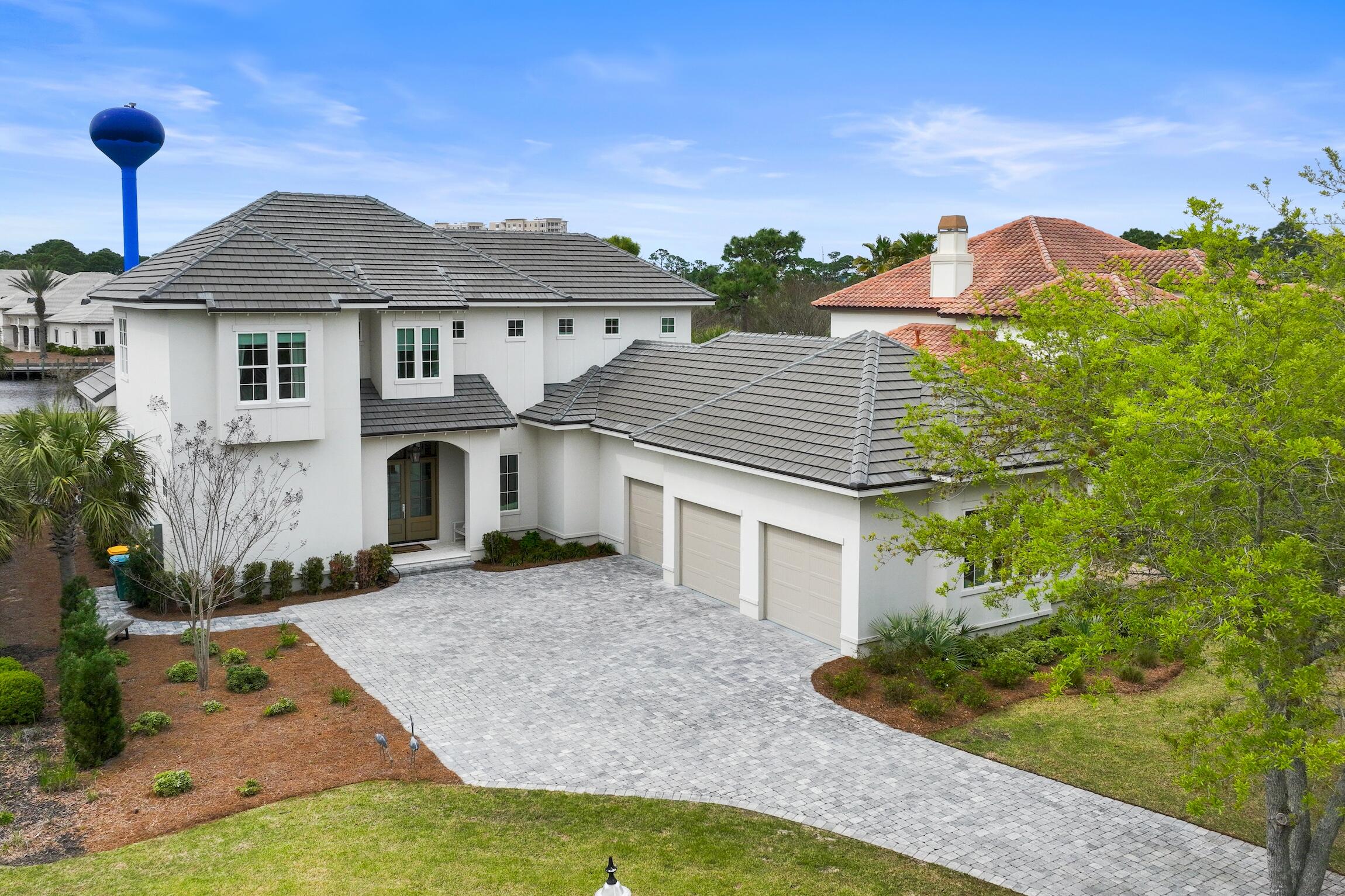 Beautifully constructed in 2021 by Legendary Home Builders, 298 Corinthian Pl. has everything you want and need! This quality-built luxury home offers an extended kitchen/dining/living open floor plan- perfect for entertaining and relaxing. The gourmet chef's kitchen features TWO large islands, Wolf & Subzero appliances, wall to wall custom cabinetry and a large walk-in pantry. The Master Suite, which is located on the 1st floor, offers views of the outdoor living space including the lake and the Award-Winning Regatta Bay Golf Course! The spacious master bath features a separate walk-in custom tiled shower, a large soaker tub, separate his & her vanities, and a huge his & her walk-in closet with access to the laundry room! You will find a guest suite on the first floor and 3 additional guest suites and a large bonus room on the 2nd floor. The outdoor living space and summer kitchen has over 600 feet of room to stretch out and enjoy the Florida breeze all while taking in views of the golf course and lake. Covered and protected from the Florida sunshine but also equipped with a beautiful fireplace for those chilly nights. This home was designed with high quality fit and finishes including quartz countertops, hard wood flooring, an over-sized 3 car garage, Wind and Impact Resistant Windows & Doors, Insulated Garage Doors, Foam Spray Insulation in Roof for Superior Energy Efficiency, Stainless Steel Screws, Nails, Flashing & Straps, Treated Plywood on Lower Section of all exterior walls.
(specifically designed to maintain integrity & durability), Custom Solid Wood Cabinets & Cabinet Doors, Interior Walls Insulated for Soundproofing, Moisture Resistant Sheetrock used in all Bathrooms, Sound Insulated A/C Ducts, Solid Core Interior Doors,
Strong Tie Cable Hurricane System, and a Tankless Water Heater with Recirculating Hot Water Lines for Instant Hot Water Throughout the House. When you purchase in Regatta Bay you are purchasing more than just a home you are buying a lifestyle. Regatta Bay is located in the middle of Destin's finest shopping and activities. Leave the car at home and jump on your golf cart to enjoy the beach, boating, shopping and dining!