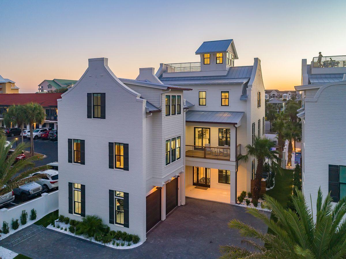 Noteworthy coastal design and exemplary architectural significance beautifully characterize the bespoke beachside retreat of Park Row at Crystal Beach primely situated in the heart of Destin, Florida. This masterfully planned development was envisioned and executed with the utmost quality while remaining uncompromised in optimal function and lifestyle taking full advantage of premium positioning near an exceptional beach access and world class restaurants including Camilles at Crystal Beach, Henderson Beach Resort & Spa as well as the Destin Commons, Whole Foods & Legendary Marina. Situated at the southernmost point of the esteemed Park Row ensemble is 78 Hutchinson Street, which boasts panoramic gulf and bay vistas primely positioned just steps from beach access. Captivating white-washed brick parapet walls and caribbean-style landscaping offer a striking contrast yielding to a welcoming sense of arrival defined by an expansive promenade of belgian cobblestone pavers, low maintenance synthetic turf and hand selected sylvester palm trees. This 9 bedroom resort-style residence has been optimally designed for entertaining and would be an ideal second home or outstanding short term rental with permanent occupancy granted for 33 people and over $340,000 in projected gross annual rental revenue. The contemporary open floor plan and strategic positioning of each structure allows for captivating gulf views providing unparalleled amenities including a 50,000 gallon private resort-style pool area complete with a sunken swim-up bar as well as an adjoining spa, in-pool concrete picnic table, ambient gas lanterns & covered outdoor summer kitchen offering a linear gas fireplace and stainless built-in grill. The outdoor amenities also include sprawling covered porches as well as a private sun deck overlooking the pool area with ample space to enjoy the Florida sunshine and afternoon seabreeze. This home was designed to maximize functionality and finely appointed with chic contemporary finishes while affording exceptional comfort & living space. Notable features include multiple indoor and outdoor living areas, private commercial grade elevator, separate two car garage for owner's storage or guest storage, 8 parking places, dual master suites with gulf views, built-in pinterest worthy bunk beds, indoor and outdoor surround sound system as well as security cameras for privacy. The first floor layout boasts a spacious bunkroom, laundry area, large bedroom suite with ensuite full bath as well as an expansive game room complete with pool table & built in wet bar which flows seamlessly to the outdoor resort amenities. The second floor is the focal point of indoor living space with a sleek contemporary living room featuring pecky cypress ceilings, floor to ceiling windows to soak in natural light, linear gas fireplace with stone surround and open to the chef's kitchen & dining room for optimal flow. The finely appointed open-concept kitchen features floor-to-ceiling custom cabinetry, hand built custom hood perfectly framing the 60" Wolf professional series gas range, oversized refrigerator and ample storage anchored by a massive center island crowned with gorgeous quartz countertops and a Kholer stages series stainless sink. The second floor also features three full bedrooms with ensuite bathrooms, convenient half bath as well as access to the second story outdoor living area overlooking the lagoon style pool. The third floor features a completely separate bunk room and kids playroom with it's own full laundry area and ensuite bathroom. The dual master suites also occupy the third level with spacious covered porches, private coffee & wine bar, spa-like master bathrooms with marble flooring and accents as well as a walk-in shower, free standing tub and spacious closet. The fourth story viewing deck was designed to maximize the incredible gulf and western oriented views that surround this prestigious property.