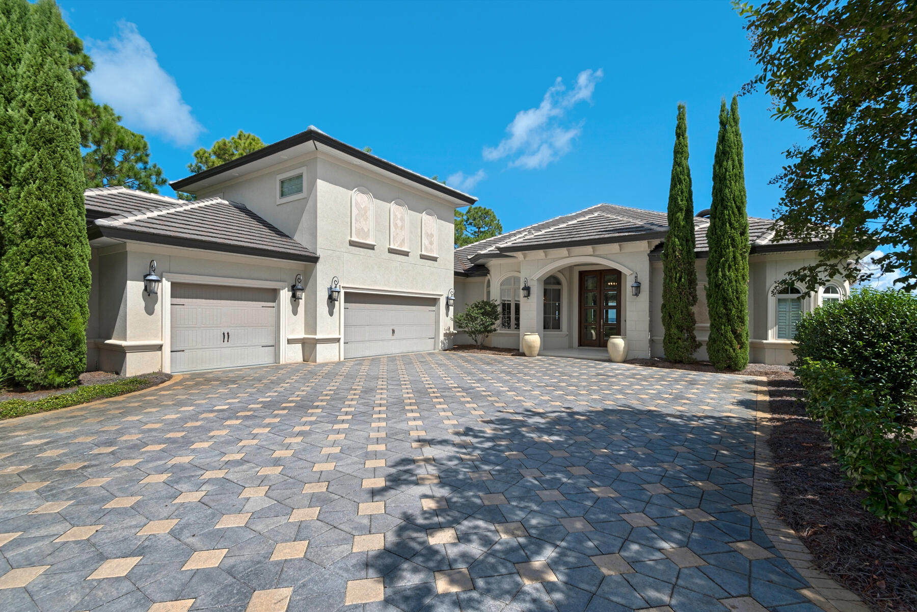 Under Contract w/ 72 Hr Kick Out.  Welcome to the perfect bay-front estate located at 1201 Driftwood Point Road.  Look no further for your family, your boat...and cars!  The dock built in 2018 with boat slip and a 16K lb lift enjoys deeper water than most bay-front estates and offers a seating area for watching sunsets, the kids and dolphins play.  This immaculate and meticulously maintained home is adorned by nature and inspired by the love of family.  Luscious landscape and a tree lined brick paver driveway create a true sense of arrival.   Upon entering the foyer, you are captivated by the bay views and the open plan which affords effortless ease of living and entertaining.  The expansive glass doors and windows punctuate the bay view and outdoors luring you to the covered lanai, natural gas heated pool, and outdoor living room featuring a kitchen and fireplace.  Here you will spend most of your time outdoors enjoying the lanai and gathering to watch your favorite movies.  The grassy lawn ideal for children to run and play leads to the dock on the bay.        
The open floor plan with 12 foot ceilings in the main living area boasts a gourmet kitchen with a family sized bar easily accommodating 8 bar stools.  The eye pleasing kitchen features a gas slide in range, below counter microwave and ice maker, and a breakfast niche overlooking the pool and bay.  The customized laundry room with window, has plenty of storage and a built in wine cooler. The kitchen marries the formal dining and living room.  The fireplace is framed by custom built-ins and the whole house surround sound system extends to the lanai.  The dramatic master bedroom suite with sitting area opens to the bay.  Prepare to feel pampered in the huge luxurious master bath with elevated free standing soaking tub and expansive wrap around dual vanities to please any couple.  There is a large separate walk in shower and a separate water closet.  The master bedroom closet is customized and conveniently located between the master bedroom and bath.  The office with built-ins overlooks the bay and lanai.  Quality and attention to detail is evident throughout with hard surface flooring throughout the first floor, solid doors, tray ceilings, recessed lighting, deep base boards, beautiful cabinetry and hardware. The second level is currently being enjoyed as a theatre room with overflow storage.  Let your imagination explore utilizing this space for live/work, home school, a home gym or create an additional bedroom.  This immaculate home reflects pride of ownership in the maintenance and improvements.  The owners replaced lighting, updated the fireplaces with coquina shell, replaced 2 HVAC units in May 2021, and added $30K in rip rap to the shoreline.  We invite you to discover the beauty of gracious living at 1201 Driftwood Point Road.  Make your appointment today.  Buy now and close in December and bring in the New Year on the bay!