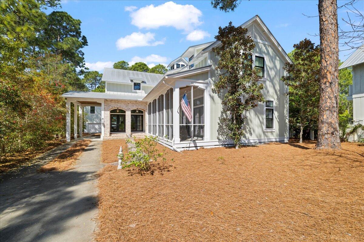 Nestled in the secluded, established Sugarwood Beach community, this exquisite Seagrove home offers the perfect balance of privacy and convenience. Tucked away from the hustle and bustle yet just moments from everything 30A has to offer, you'll enjoy deeded beach access, scenic bike paths, boutique shopping, fine dining, and endless coastal adventures — all right at your fingertips.

Step through the arched brick entry and into a beautifully crafted home where thoughtful design meets timeless charm. Designed by Chris Stoyles, this masterpiece features stunning 6'' white oak flooring, shiplap walls, and custom solid quarter doors, creating a warm and inviting atmosphere. The open-concept kitchen, dining, and great room flow effortlessly, with a cozy sitting area anchored by a fireplace and soaring 23' vaulted ceilings. The kitchen boasts Carrara marble countertops, ample cabinet space, a farmhouse sink, and large windows that flood the space with natural light.

The first-floor master suite is a peaceful retreat, complete with a spa-like ensuite bath. Upstairs, you'll find two additional bedrooms with ensuite baths, plus a cozy sitting area for added relaxation. The expansive 760 SF carriage house provides a private and comfortable space for guests, featuring hardwood floors, marble counters, ceiling fans, a living area, a kitchen with a two-burner stove and microwave, a bathroom with a shower, and ample storage. Below, a spacious two-car garage doubles as a potential workspace, offering both functionality and versatility.

This home is equipped with a Generac generator and benefits from a 70' deep well for irrigation, ensuring efficiency and convenience. Situated on a generous lot, the property also features expansive screened porches and a private backyard perfect for unwinding or entertaining. The lot is large enough to accommodate a private pool, making the possibilities endless. The main home is equipped with three AC units, while the carriage house has it's own dedicated unit to ensure guests' comfort.

This exceptional property truly embodies the essence of 30A living, where luxury and coastal charm come together in perfect harmony. Contact us today for a private tour and experience this remarkable home firsthand.
