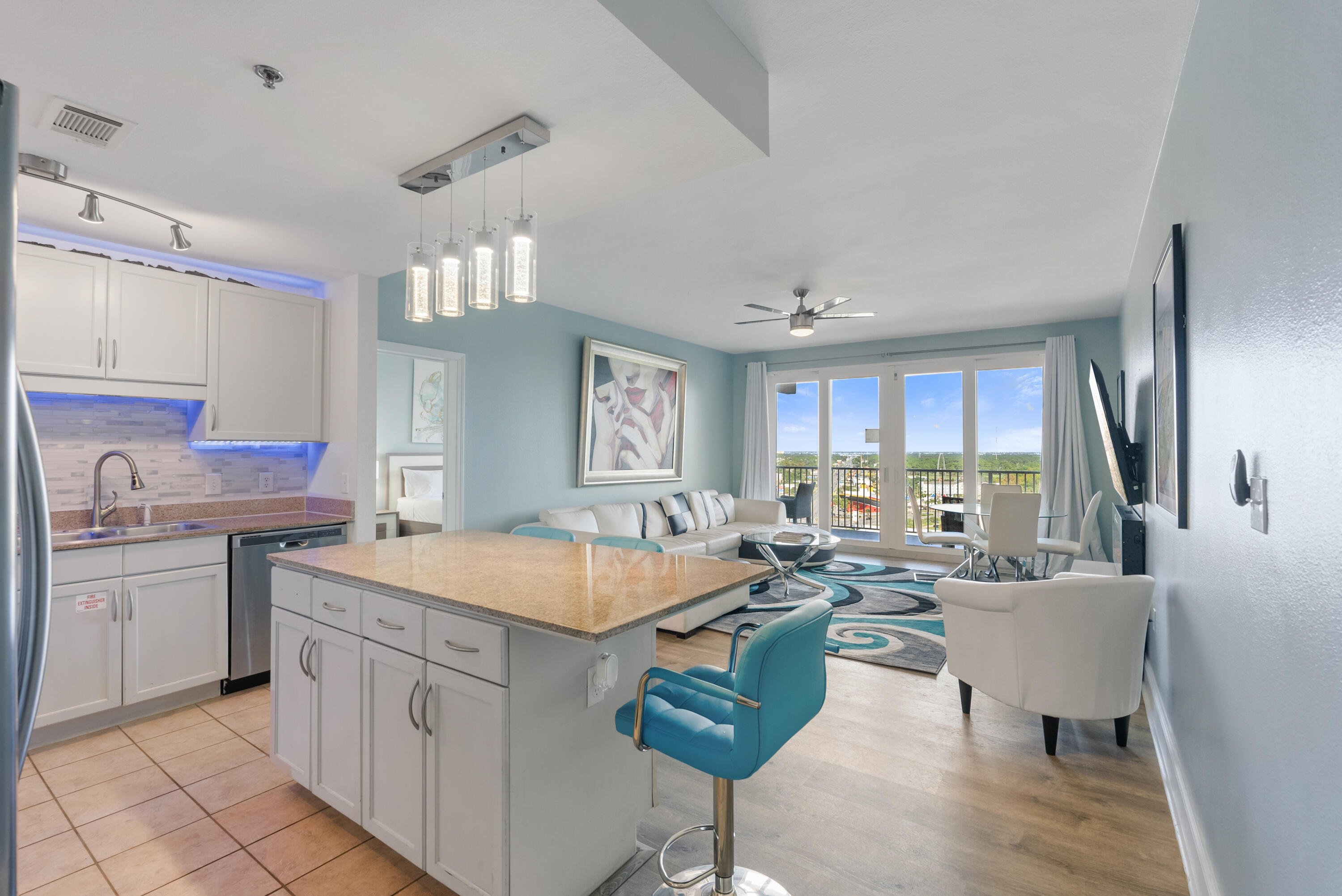 Fully renovated turn-key 3BR/2 BA condo in the beautiful Laketown Wharf Beach Resort.  This 1262 sqft unit offers spectacular city/lake views from the 15th floor!  This unit has been continuously profitable: 2021/$61,569, 2022/$50,499, 2023/$52,499, 2024/$49,858 and 2025/$55,656.

Can be used as primary residence, short term rental or investment property AND this unit is being sold FULLY furnished - with no exclusions!  Everything you see in the photos and viewing is being sold with the property.  All furniture/linens/tv's/appliances/etc - turn-key and income producing!  

Step into the coastal ambience of this beautifully themed condo with touches of rich blues, whites, and creams.  Your kitchen gives ample space to cook up that delicious meal as you return home from the emerald coast water and white sugary sands of the PCB coast, all just a few minutes walk, with convenient access for Laketown Wharf guests.  Your kitchen features white cabinets, granite countertops and LED lighting throughout.  Nestled close by you can relax on your large oversized couch, next to your electric fireplace with a large TV above.  Step onto your private patio, overlooking Panama City Beach with gorgeous city and lake views below.  Be mesmerized each night by the fountain and light show dancing on the lake waters below, right next to the boardwalk, where restaurants and shopping line.  Soak up the rays during the day, all enjoyed in the privacy of your own balcony deck with views most dream of.

Escape to your master suite with adjoining master bath and soak your cares away in your large master soaking tub.  Master bath also includes dual vanities and shower.  Step out your doors of your master suite right onto your private balcony. The extended balcony can be accessed from the living room and the master suite! 

There are two additional bedrooms with a shared bathroom, also with a shower and tub combo.

This unit sleeps 6 comfortably but can accommodate up to 10 people so it's perfect for large families and entertaining.

Laketown Wharf Resort is in the heart of all the fun & excitement of Panama City Beach.  Just steps away from the world's most beautiful white-sand beaches, shopping, dining and entertainment.  Amenities include: convenient beach access, 5 unique pools, a kids funscape playground, Splash Bar & Grill, Gulf View Fitness Center & covered garage parking. Laketown Wharf Offers A Variety Of views Including The Gulf Of Mexico, Lake & Golf Course. Enjoy the nightly fountain & light show & market shops along the 52,000 sqft Of Lakefront Boardwalk.