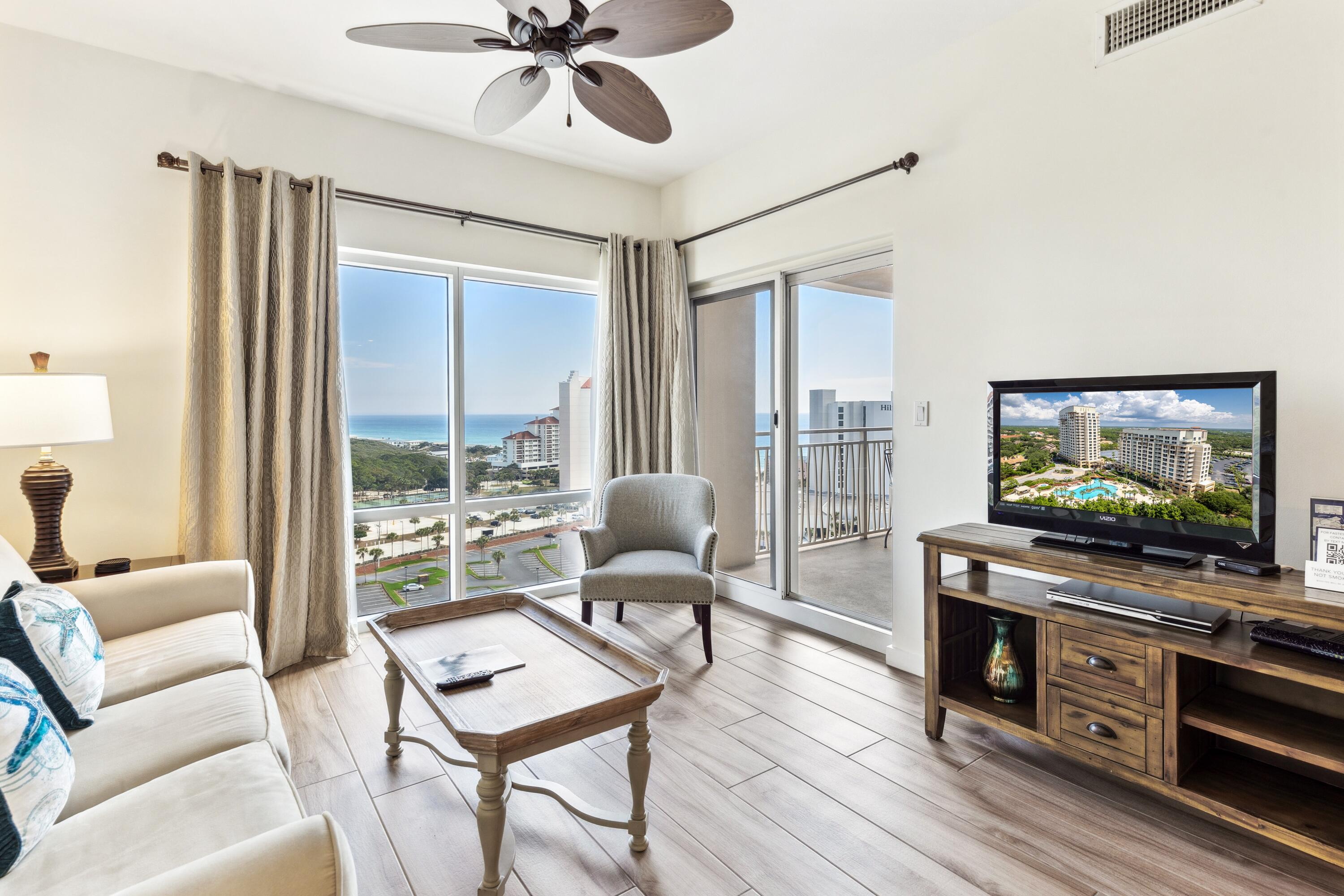 This fully furnished, beachside getaway offers breathtaking Eastern 180° views from the covered balcony, spanning the beach to the bay. Stylish porcelain plank tile flooring flows throughout, complementing the updated kitchen with painted white cabinets, white quartz counters, and stainless steel appliances.
The full bath, accessible from both the bedroom and foyer, features a new white vanity. A new HVAC (2022) and water heater (2026) ensures comfort year-round. For those seeking fun in the sun, the private complex pool awaits, adorned with loungers, a grotto waterfall, and a seasonal Tiki Bar offering food and an array of refreshing libations and frozen cocktails. Across the street is the Sandestin private beach! As an introduction to the Sandestin lifestyle, we invite our new owners to explore amenities that make Sandestin special. The listing brokerage and seller(s) are presenting the buyer(s) of this property with (2) 90-minute rounds of Tennis court time, a golf foursome at one of our three championship courses, and a round of golf for up to four (4) players at the unrivaled Burnt Pine Golf Club.

Sandestin Golf and Beach Resort features more than seven miles of beaches and pristine bay front, four championship golf courses, 15 world-class tennis courts, a 226-slip marina, a fitness center, spa and celebrity chef dining. Shop, dine and play at the charming pedestrian village, The Village of Baytowne Wharf and more. Inside the gates of the resort, residents enjoy a balanced lifestyle of high-class living, spanning the 2,400 acres from the beach to the bay. Everything within the gates of the resort is accessible by golf cart or bicycle. The entire resort is interconnected by miles of pedestrian, bike and golf cart paths that weave through groves of live oaks, meandering past natural lagoons, fountains, man-made lakes, and meticulously landscaped fairways.