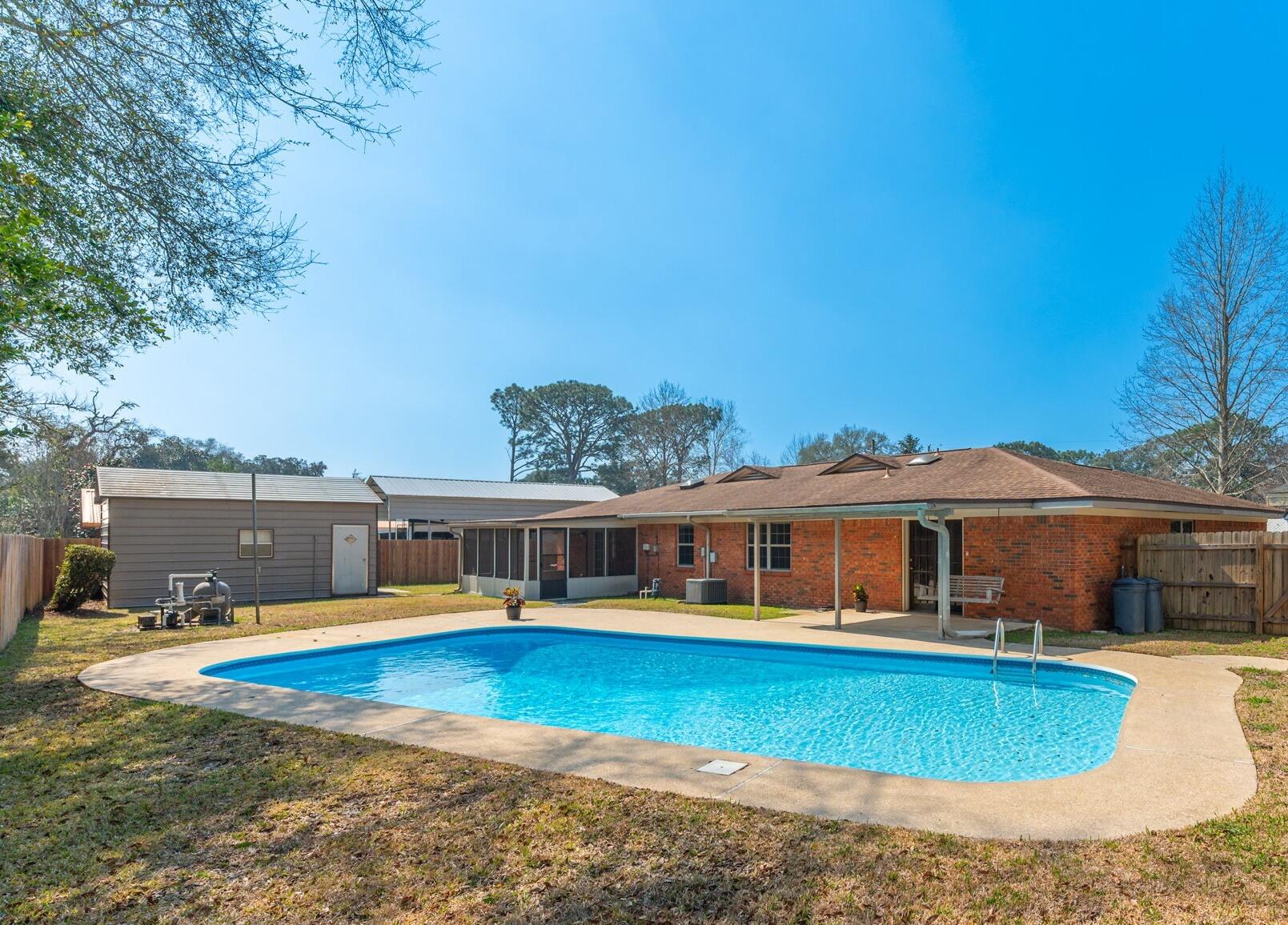 FAMILY FUN AWAITS! Classic Florida Ranch Style POOL Home in the Highly Sought after Longwood Subdivision / Poquito Bayou area! This Waterfront Community has its own Private Waterfront Park with Dock, Beach, BBQ & Picnic Area (3 Blocks) / Boat Ramp & Park (9 Blocks) / Kids Playground & Picnic Area (1 Mile). Features and upgrades include: 36' x 18' Pool / Brand New Pool Pump / 2025 House Re-wired / 40' x 15' Detached 1 Car Garage & Workshop / Double & Single Gates Back Yard Access / Room for your RV or Boat / 2025 Gas Hot Water Heater / 2020 AC & Gas Furnace / 2011 Double Paned Windows / NO HOA / Gas Stove / Pantry / Screened Porch / Covered Patio / Brick Exterior / 2 Car Garage / New Lawn Pump.  Located just outside Eglin AFB's Main Gate / Approx 7 Miles to Hurlburt Field and ... ...still only 8 Miles to the BEACH and all the FUN this area has to offer!! $40 yearly membership required for access to Longwood Waterfront Park.  Buyer to Verify all Dimensions and Information!