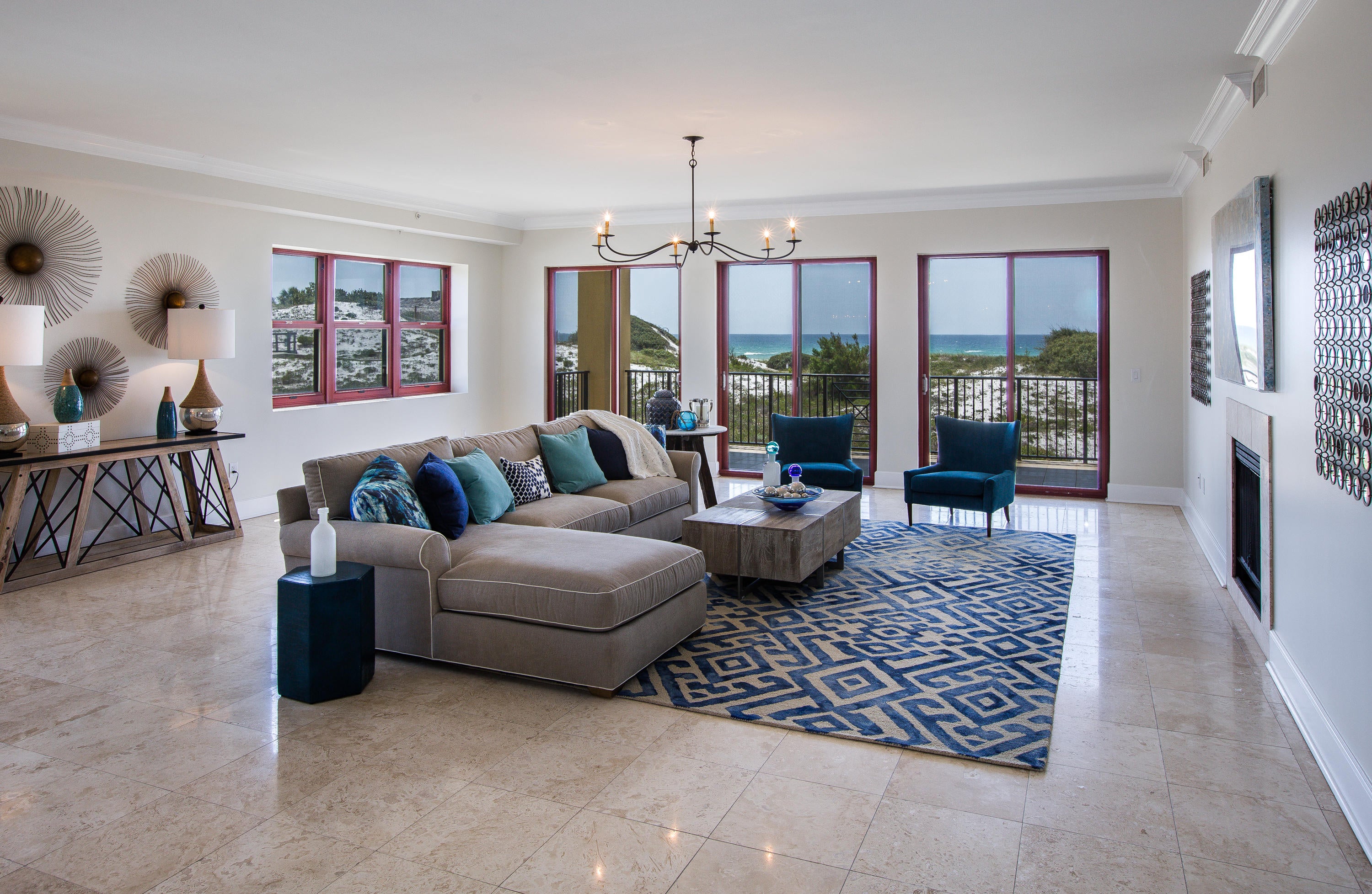 If you are looking for a home with that ''Wow Factor,'' this gulf front condominium residence is for you! Bathed in natural light, this rare corner unit offers travertine flooring, a gourmet kitchen with professional Viking appliances, a home theater, 10' ceilings, a wet bar & direct gulf-front views from the living room, kitchen, dining room, and master bedroom. The residence has a gulf front balcony that is 50 feet wide...as wide as most gulf-front lots! With over 4300 sq ft, this luxury condominium was recently painted and furnished by a local designer. The two guest bedrooms have a balcony that overlooks the lush pool and tropical landscaping. Sanctuary by the Sea offers private 24 hr security, 650 ft of private beach, 3 large pools, a fitness center, covered parking, & virtual golf