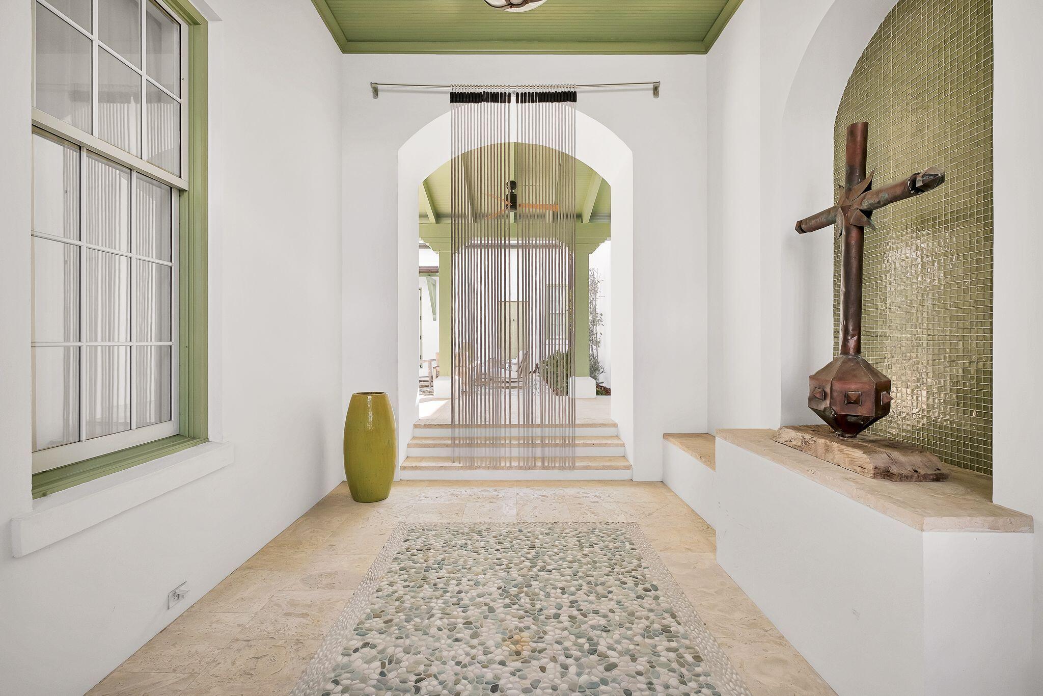 WELCOME HOME to your idyllic ALYS BEACH oasis. Located prominently in ALYS BEACH, the pinnacle of 30-A living.  46 N Charles offers the ultimate in exquisite coastal charm. Unique design by Steve Mouzon reveals a dramatic Zaguan entry into a tranquil courtyard with lush landscaping and a calming fountain. Step into an open floor plan with natural light transcending through multiple windows. Spacious living area with fireplace for those cool evenings. Flowing to the dining area with custom red gum wood built-ins, inlays, & unique architecture. Step into the gourmet kitchen with refreshing views of the courtyard, equipped with Thermador appliances, limestone counters and custom red gum cabinets. Owner's bedroom is an oasis for relaxation; positioned for privacy, featuring a cozy fireplace. Owner's premier bedroom and bath offer total relaxation (or privacy and quiet for work, if you must!) With French doors cascading to the lush courtyard, this oasis is dreamy.  Fireplace for those chilly winter evenings.  Large separate shower and relaxing garden tub for your spa days or evenings.   
Two additional bedrooms are located on the second floor with en suite baths.
At top of stairs, enjoy a quiet reading (or napping) nook overlooking the beautiful courtyard.
Outdoor spaces are abundant, making for the best in inside/outside living.  In addition to the spacious courtyard, another lovely outdoor area off the kitchen offers a perfect spot for al fresco dining with outdoor grill.  Outdoor shower by back gate is perfect for apres Gulf swimming.  Ample storage closet for all your fun toys, bikes, kayaks.   
The entire first floor is dominican stone flooring which makes for effortless cleaning and is perfect for sand, sun and water.  Uptairs floors are a beautiful pecky cypress.  All doors are solid wood.  12' ceilings on first floor give such a wonderful feeling of spaciousness. Sculpted, vaulted ceiling over the dining area is just one of the many architectural features which make this home so unique. The venetian plaster walls are the ultimate in home design.  FORTIFIED for Safer Living® construction standards are top of the line.  
ALYS BEACH offers the pinnacle in luxurious amenities.  The new Beach Club is exclusive to owners.  Totally breathtaking views, the ultimate in luxury living and dining.
Caliza Pool is another beautiful option for swimming, lounging and dining. 
Zuma Wellness Center offers the premier work out, massage and training facility.
Nature Preserve, numerous green spaces, pedestrian parks invite you to enjoy the best of beach living.
Ride your bike or walk to restaurants, shopping, entertainment and all the fun of Scenic Highway 30-A.

Alys Beach is situated within the Somerset Community Development District.
The 2023 Alys Beach Neighborhood Association Dues are:
Q1:  $1,822.50
Q2-4: $2,515.83
Buyer pays a one-time Capital Contribution in the amount of $25,000 and a one-time fee of $12,500 to The Alys Foundation at closing.
Visit the Alys Beach website at www.alysbeach.com


Start living your DREAM where every day is a weekend!
All information deemed correct but should be confirmed by buyers.