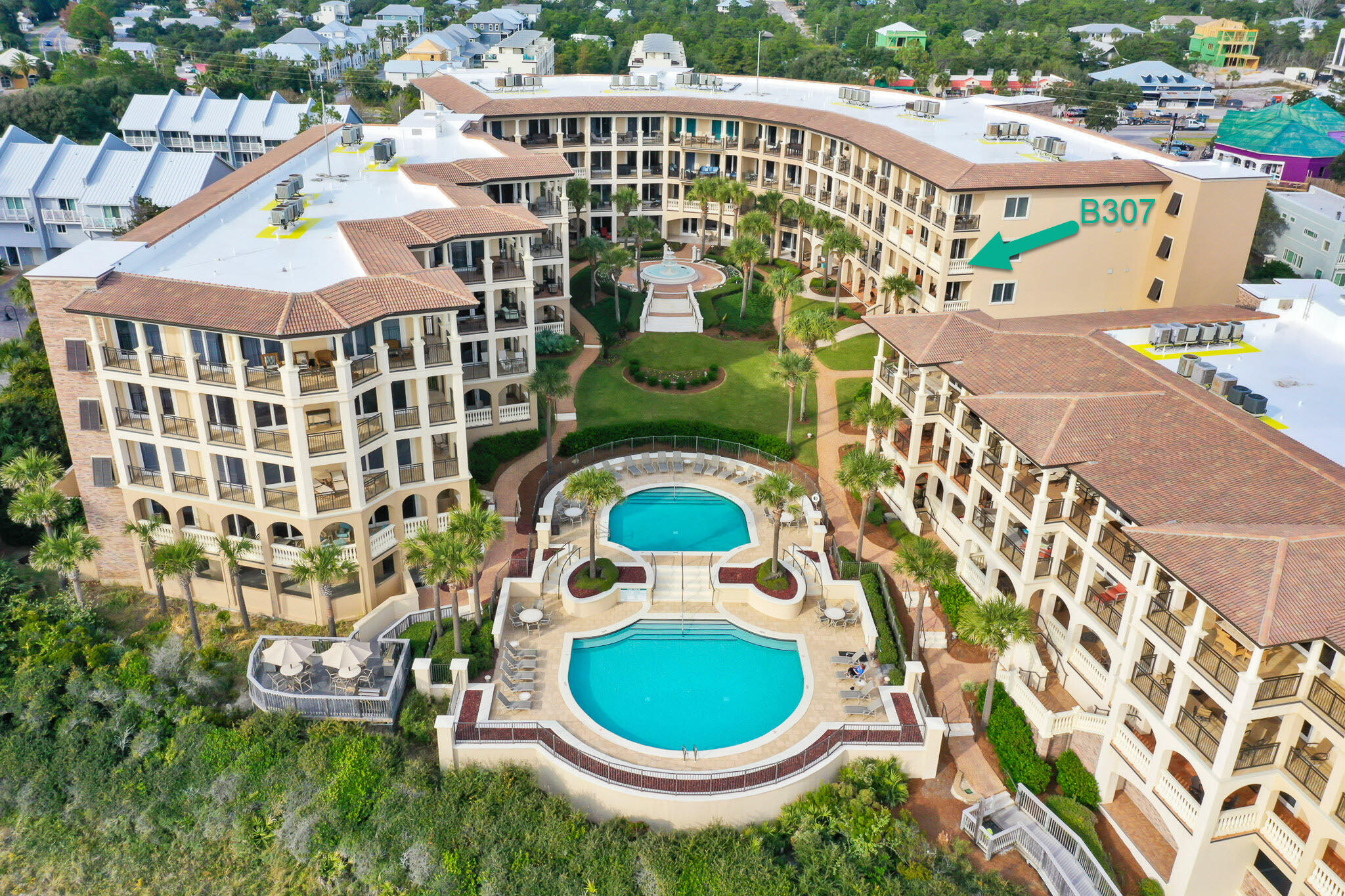 Coastal elegance awaits you in immaculate Bella Vita B307, a third-floor luxury residence in Blue Mountain Beach currently enjoyed as a primary residence. Relax on the expansive 319 sq. ft. veranda which extends the main living area and creates an outdoor living room with awe inspiring views of the Gulf, piazza and fountain leading to the Sunset Deck, two picturesque swimming pools, of which one is heated, and 365 feet of private beach. Rising above the highest point on the US Gulf Rim, living abounds from this luxurious, 3 bedroom, 3.5 bath updated home. Attention to detail and an eye for design is reflected in the owner's remodel. Step right into this chic, partially furnished condominium home with hard surface floors throughout. Upon entering, you will see, the Open Floor plan marries the kitchen, dining and living room while providing distinct comfortable spaces for entertaining coastal style.  The radiant kitchen features bright, white painted Lynn Prestige custom cabinetry, ample quartz countertop space and beautiful marble backsplash. The dramatic Master Bedroom with gulf views lets on to the veranda and features two walk-in closets and a beautiful spa-like remodeled Master Bath. The guest ensuite bedrooms are separated from the master for the ultimate privacy and each guest bath has been updated. Full list of improvements available upon request.
As a Bella Vita resident, you will enjoy a gated and brick paved entrance, ample garage owners' parking, individual and shared storage, Fitness Center, Great Hall with conversational seating areas, kitchen, library and patio. A total of only 48 residences on 6 acres have 365 feet of beach to enjoy. Rentals are restricted to a minimum of 30 days. B307 is in the B Building so owners enjoy the added convenience of the Porte Cochere Entry at the Great Hall. You will immediately see the pride of ownership within the grounds and buildings of Bella Vita reflected by meticulous upkeep. Walk to a variety of restaurants, plus a bakery and lunch shop, a health food store, ice cream and donut shop, or rent or buy a bike steps away. Hop on the 30A bike path and explore the shopping, dining and entertainment of the nearby coastal towns. Retreat to your balcony at the end of the day in Bella Vita! No short term rentals. We invite you to make an appointment to see B307 and discover the beautiful life in Bella Vita!